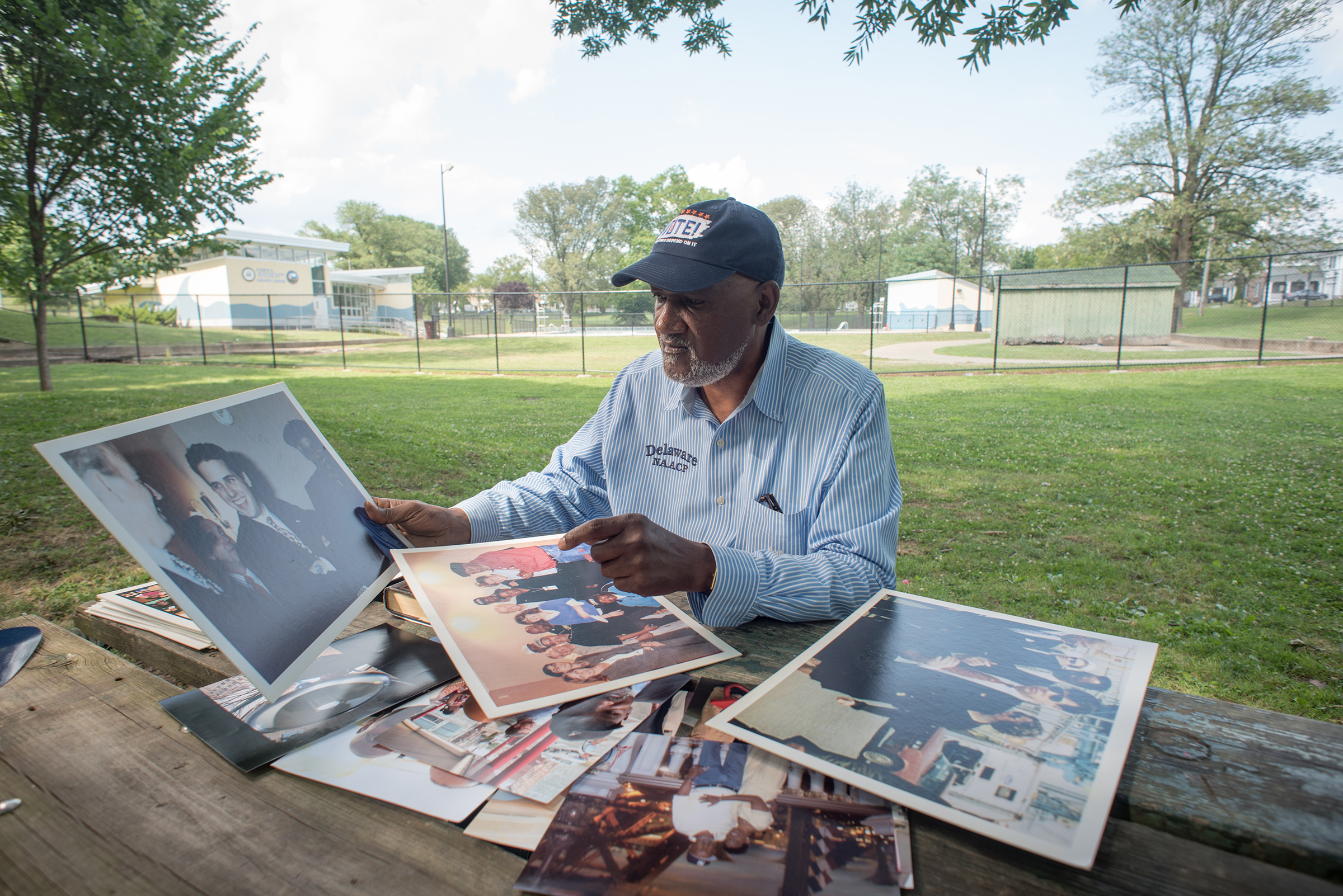 Smith displays some of the photos documenting his work as a Civil Rights leader and his decades long friendship with former Vice President Joe Biden near the pool where they first met as young men in Wilmington, Del. on July 07, 2019 (Andre Chung—The Washington Post/Getty Images)