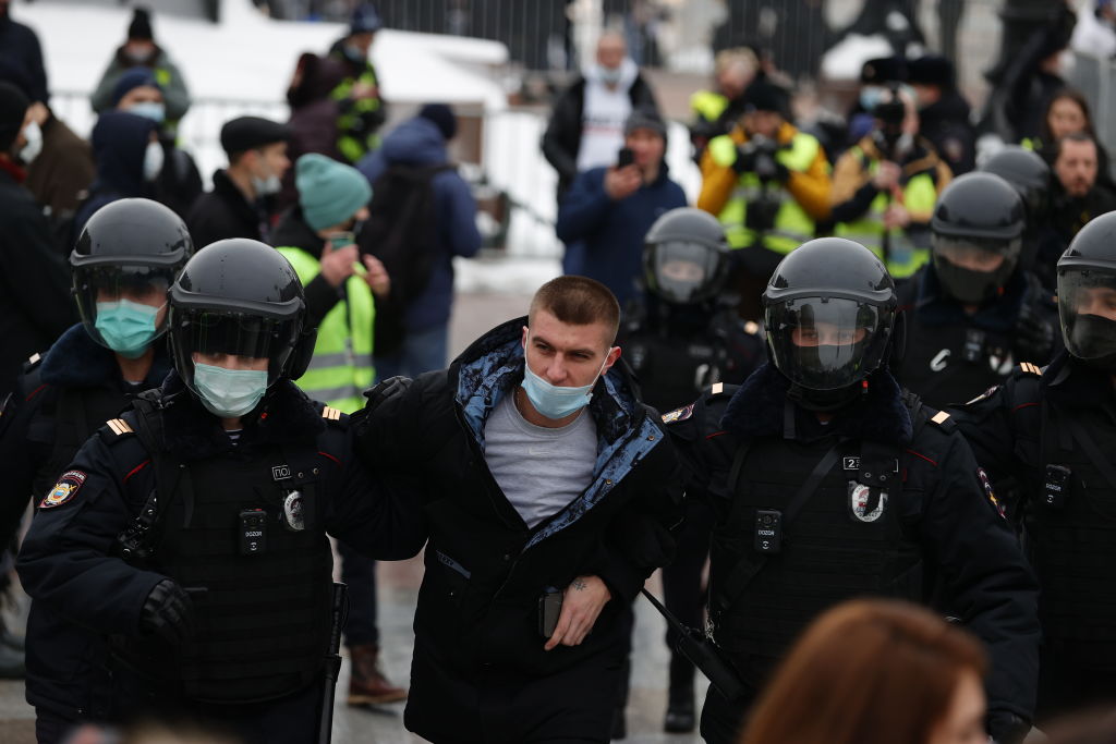 Police take protesters into custody during a protest demanding the release of Russian opposition leader Alexei Navalny in Moscow, Russia on January 23, 2021. (Sefa Karacan—Anadolu Agency/Getty Images)