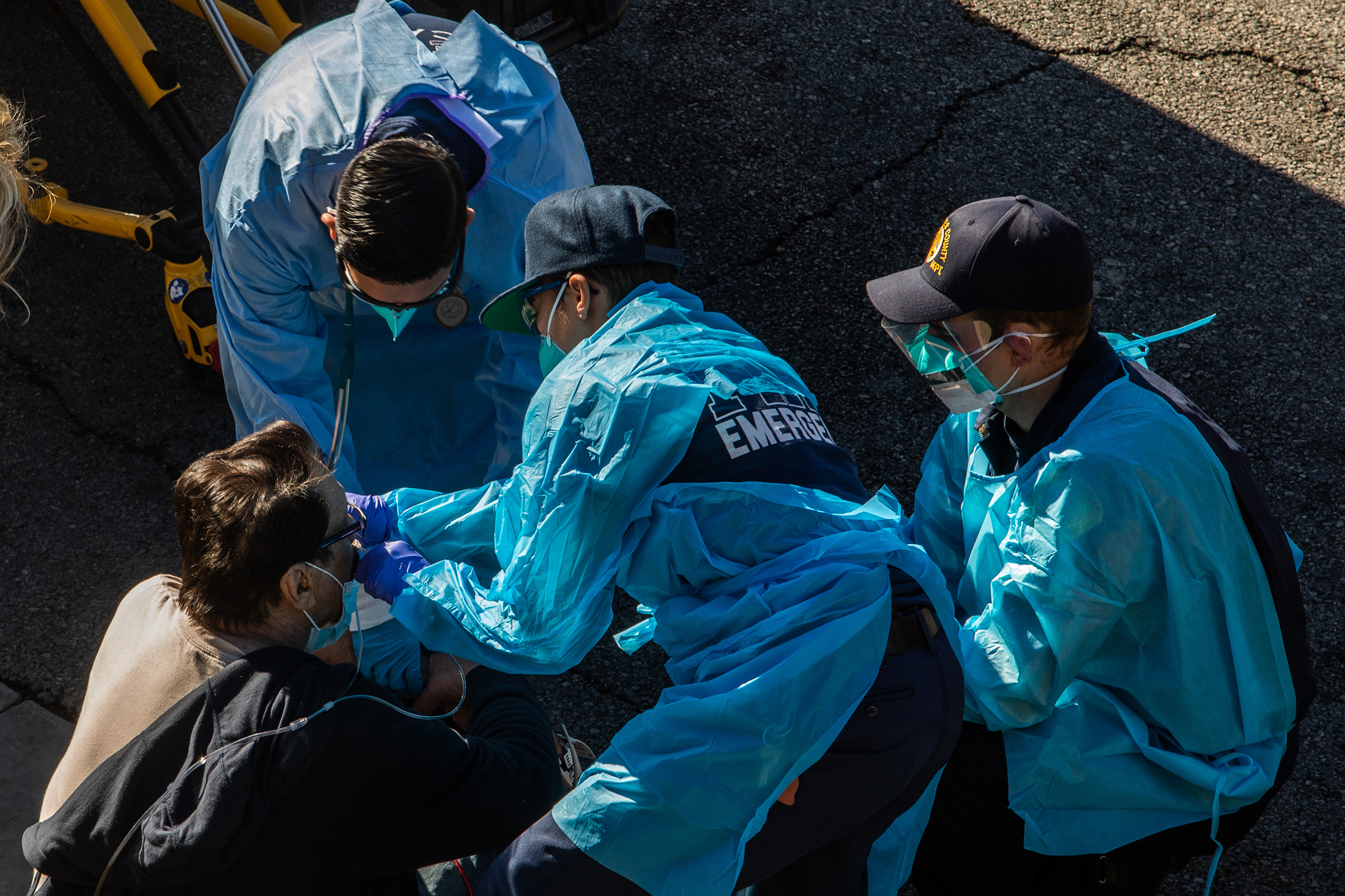 Paramedics give oxygen to a potential COVID-19 patient in Los Angeles County on Dec. 29