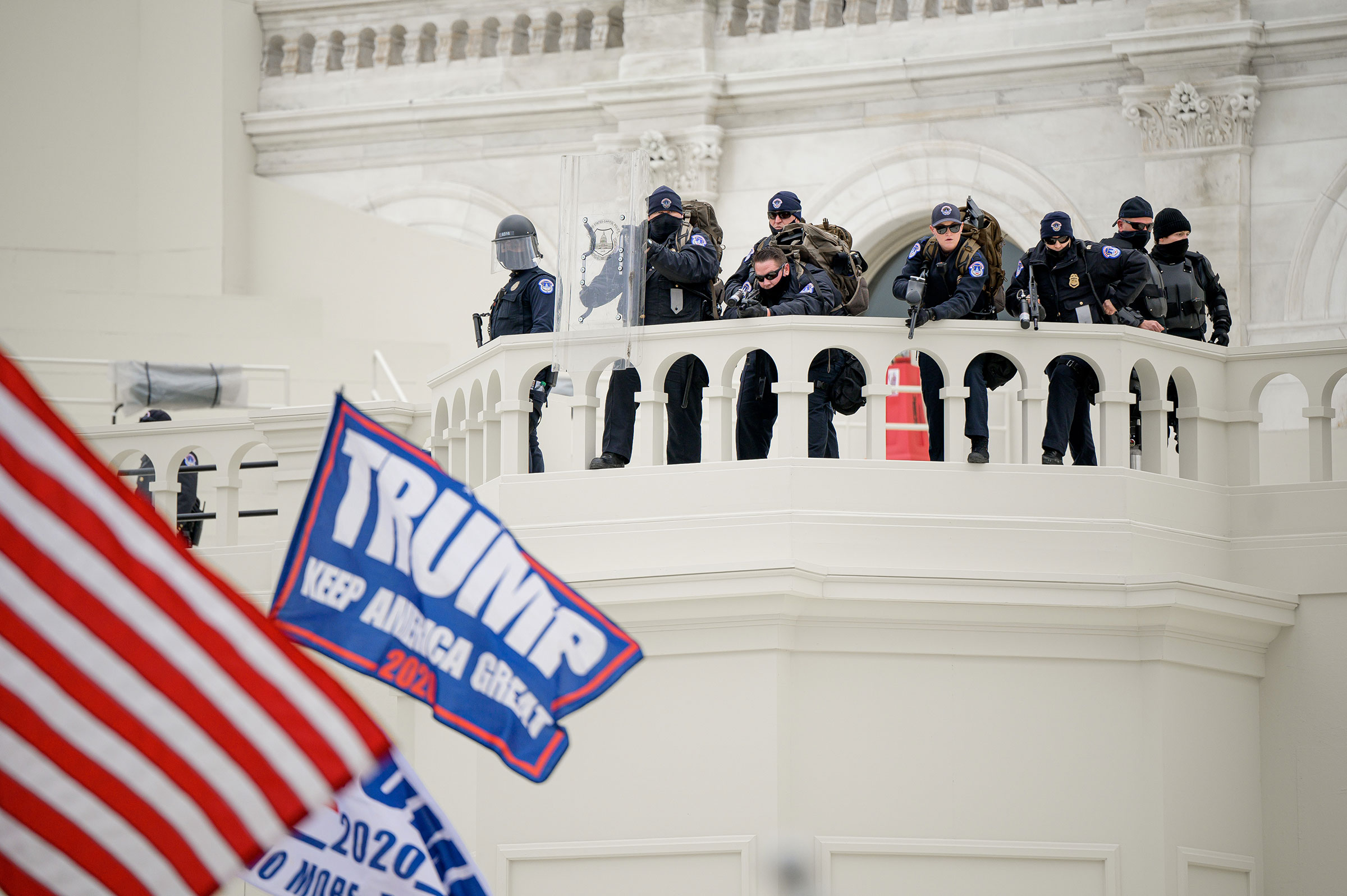Capitol police officers take position as a pro-Trump mob attempts to enter the Capitol Building. (Joel Marklund—Reuters)