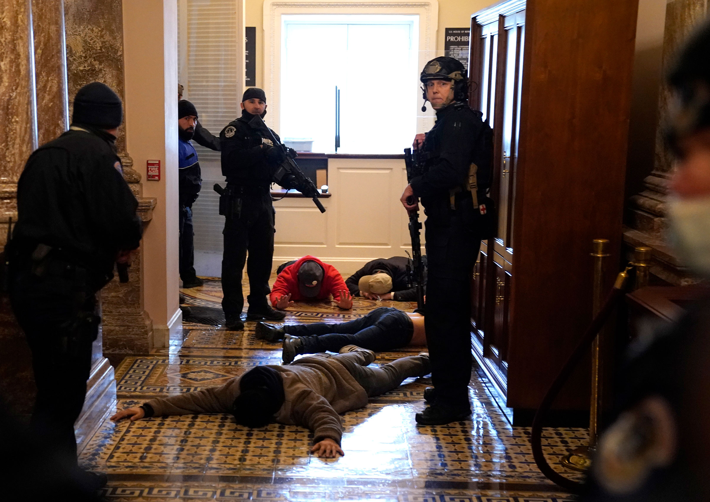 U.S. Capitol Police detain pro-Trump rioters outside of the House Chamber of the U.S. Capitol on Jan. 6. (Drew Angerer—Getty Images)