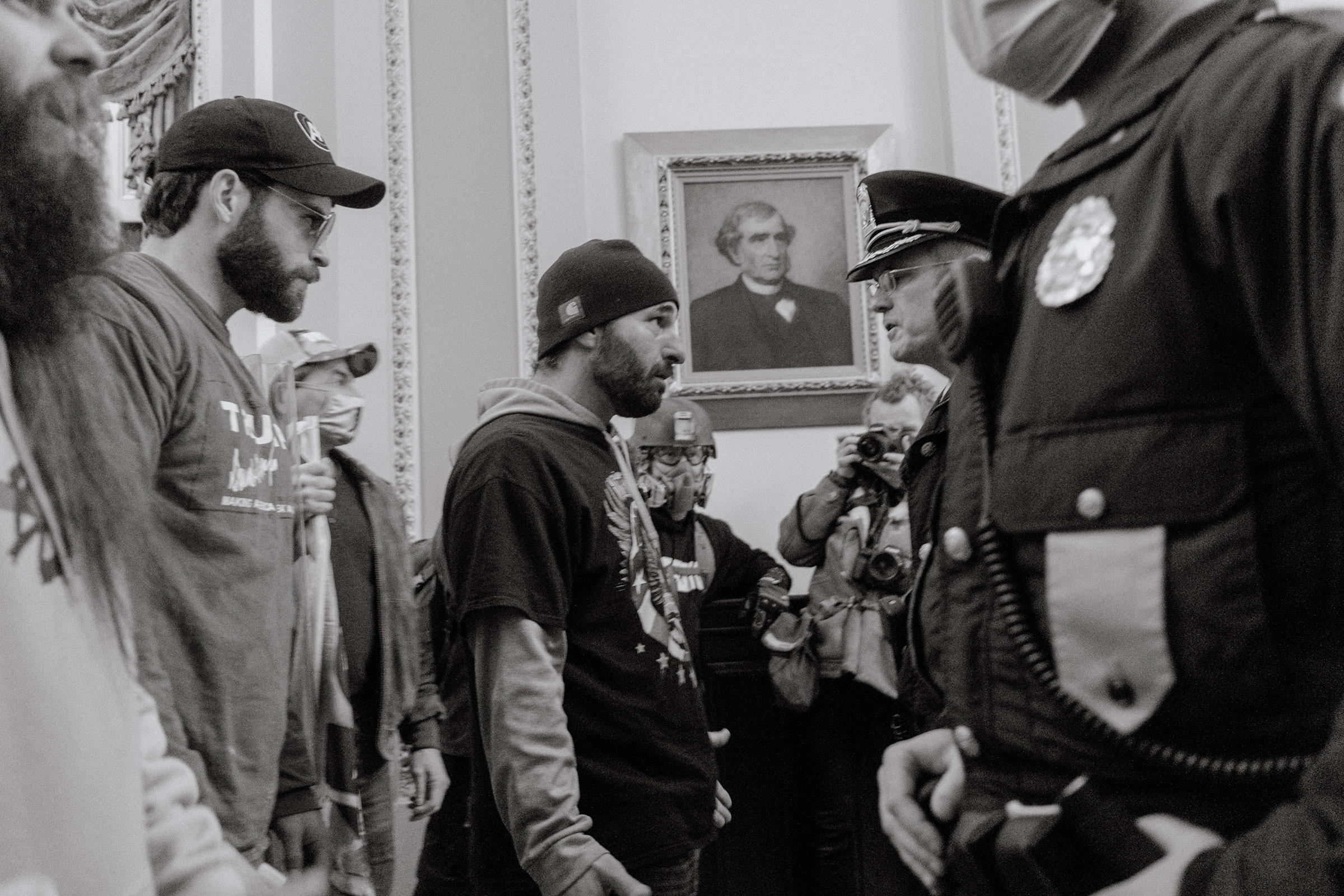 Pro-Trump rioters confront Capitol Police officers after breaking into the Capitol. (Christopher Lee for TIME)