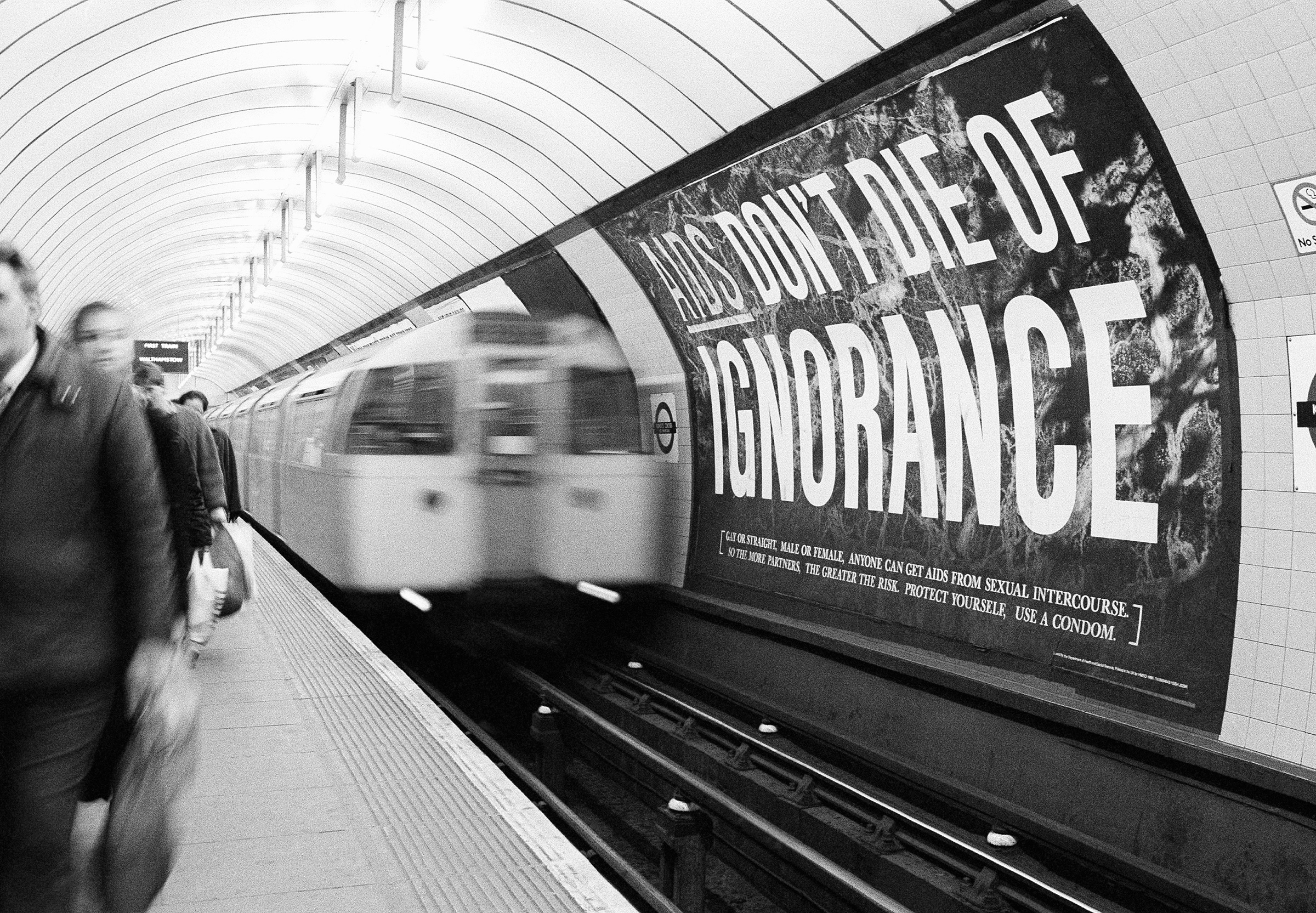 With an average of two people a day dying of AIDS in Britain, the government blitzed the nation with warning posters as part of its 20 million pound media campaign, pictured on March 5, 1987. This poster confronted passengers at the Kings Cross subway station in central London. (Gillian Allen—AP)