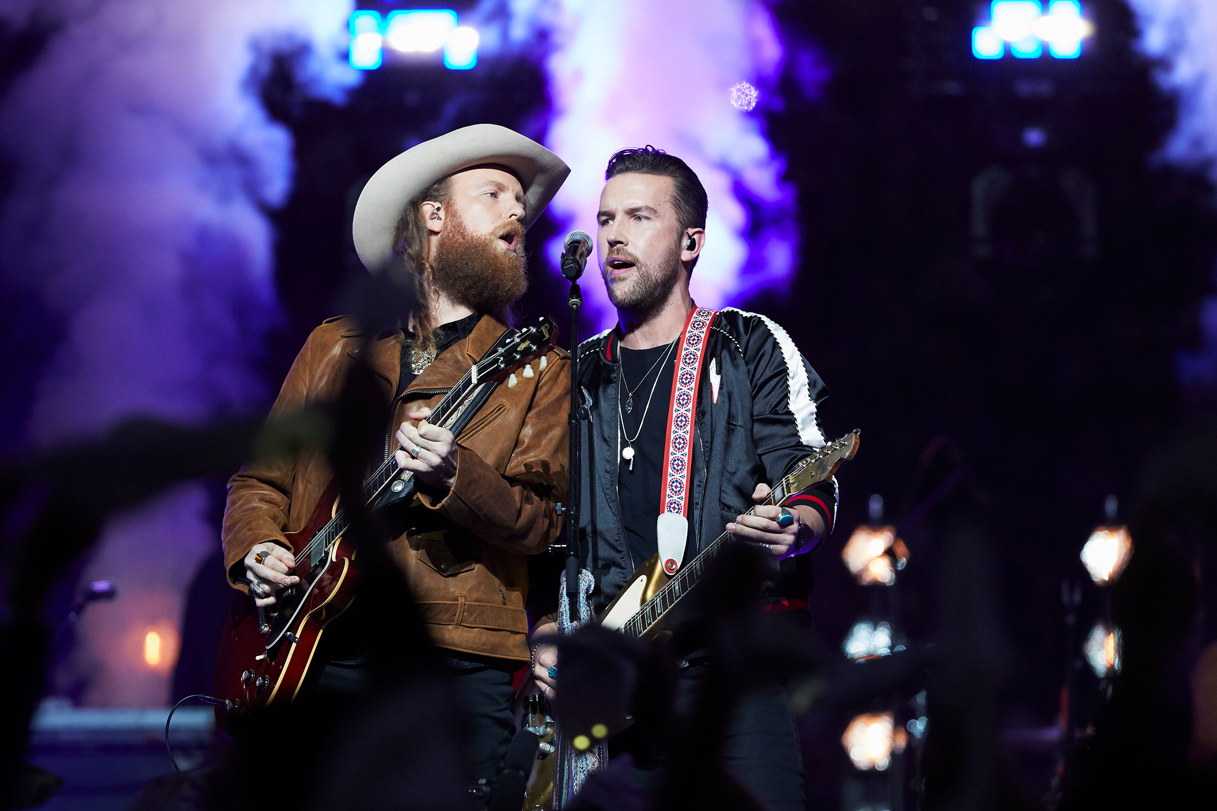 T.J., right, with his brother John, left, performing during a 2019 NFL game in Detroit (Rick Osentoski—AP)
