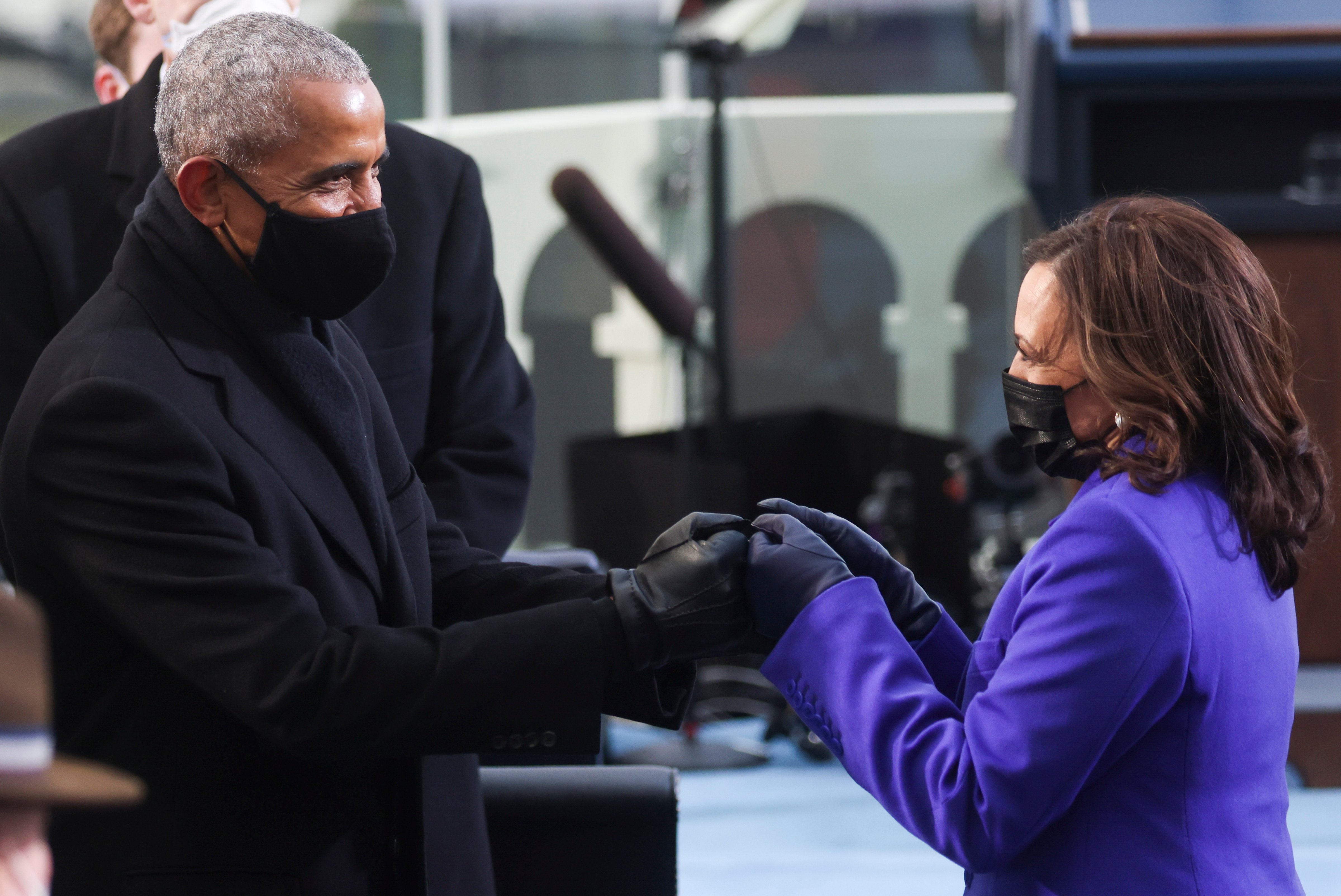 Barack Obama, the nation's first Black President, and Kamala Harris, the nation's first Black and first female Vice President, greet each other at the inauguration of President Joe Biden and Harris in Washington D.C. on Jan. 20, 2021. (Jonathan Ernst—Pool/Getty Images)