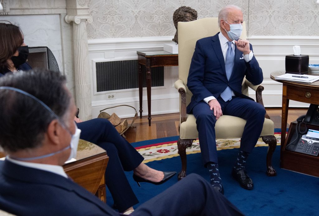President Biden met in the Oval office with Republican Senators, including Sen. Mitt Romney, to discuss COVID-19 relief plans in early February. (Saul Loeb—AFP via Getty Images)