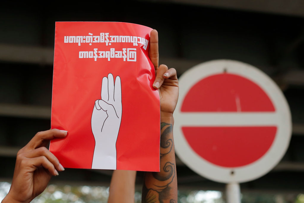 A Myanmar protester holds a placard during a demonstration against military coup in Yangon, Myanmar on February 7, 2021. (Myat Thu Kyaw/NurPhoto via Getty Images)