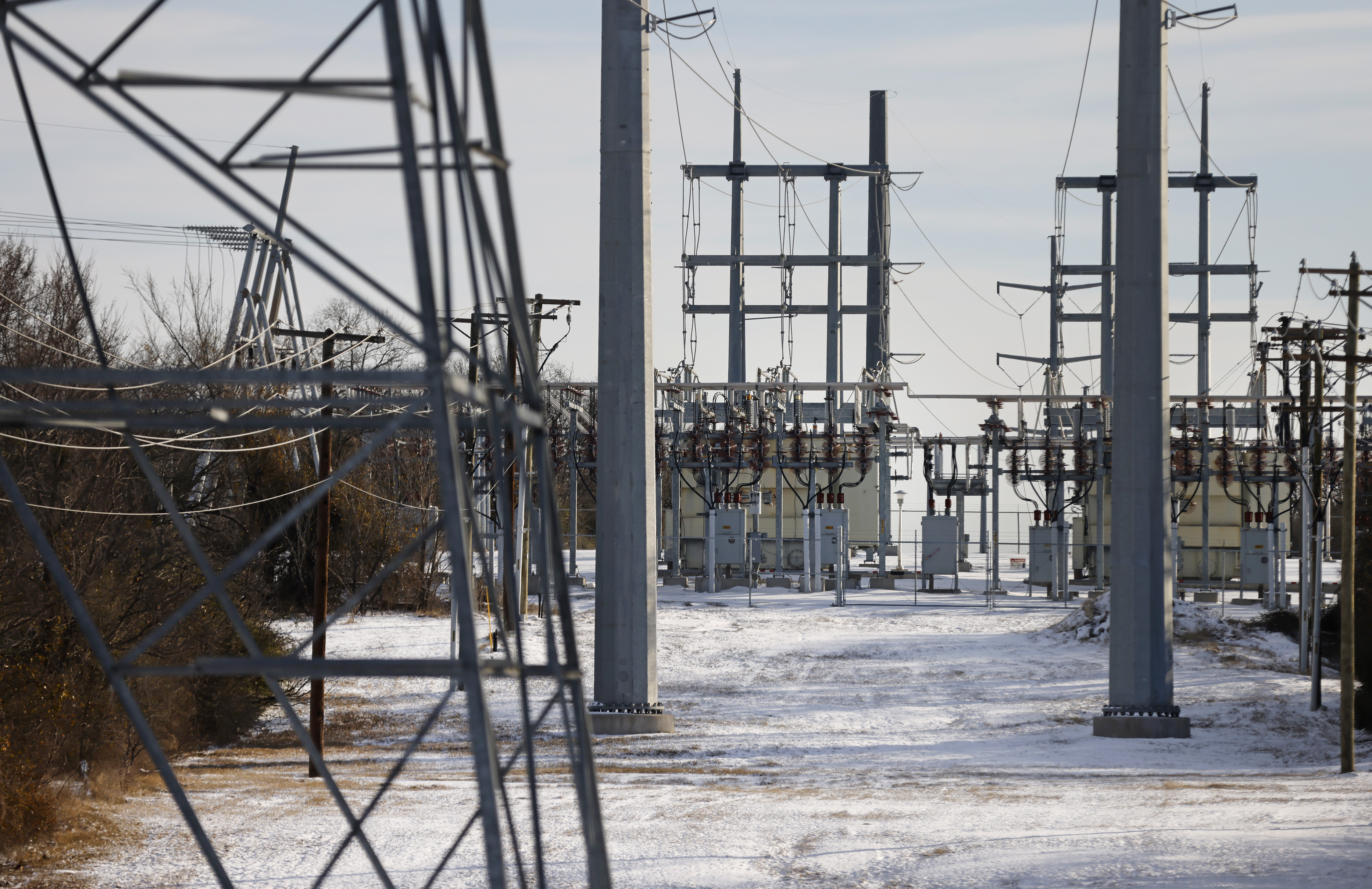 Transmission towers and power lines lead to a substation after a snow storm on February 16, 2021 in Fort Worth, Texas. (Ron Jenkins/Getty Images)