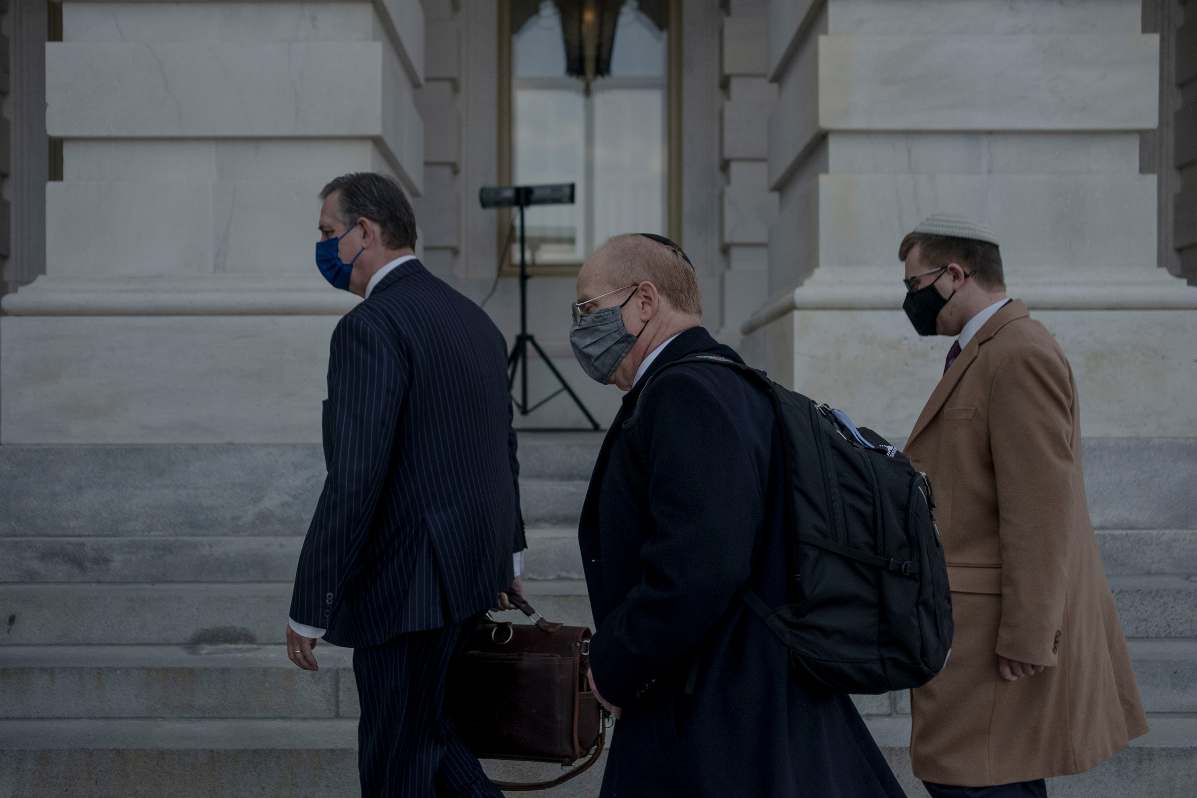 Attorneys for former President Donald Trump, Bruce Castor and David Schoen arrive prior to the start of the impeachment trial at the Capitol in Washington, on Feb. 10, 2021. (Gabriella Demczuk for TIME)