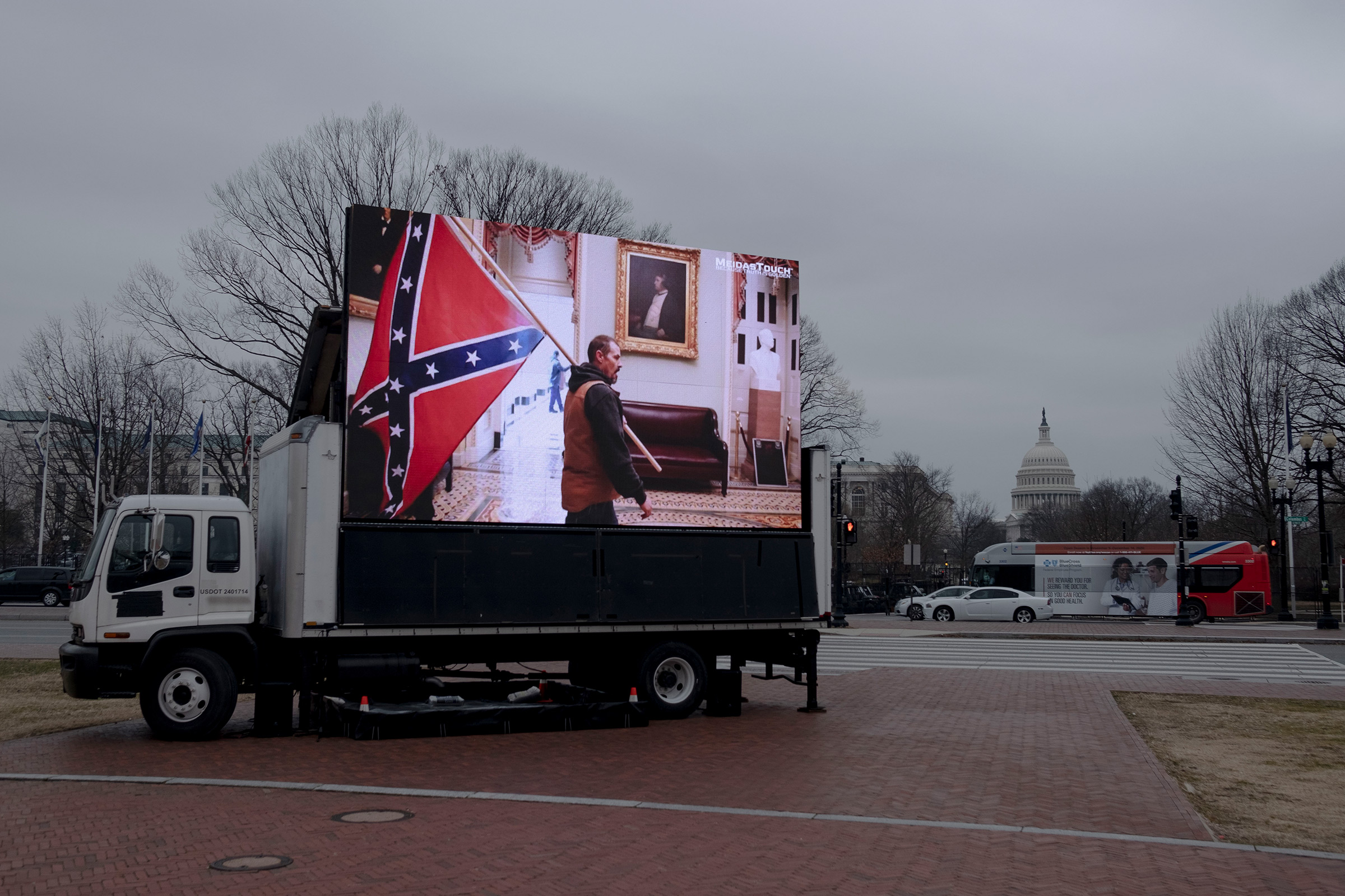 2/10/21, Washington, D.C. A truck showing scenes from the insurrection is parked outside Union Station during the impeachment trial of former president Donald Trump in Washington, D.C. on Feb. 10, 2021. Gabriella Demczuk / TIME