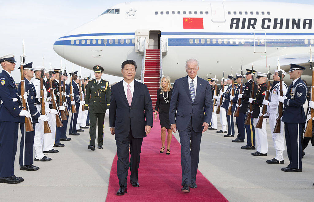 Chinese President Xi Jinping and his wife Peng Liyuan are welcomed by then-Vice President Joe Biden and Jill Biden at Andrews Air Force Base in Washington D.C., on Sept. 24, 2015. (Huang Jingwen–Xinhua News Agency/Getty Images)