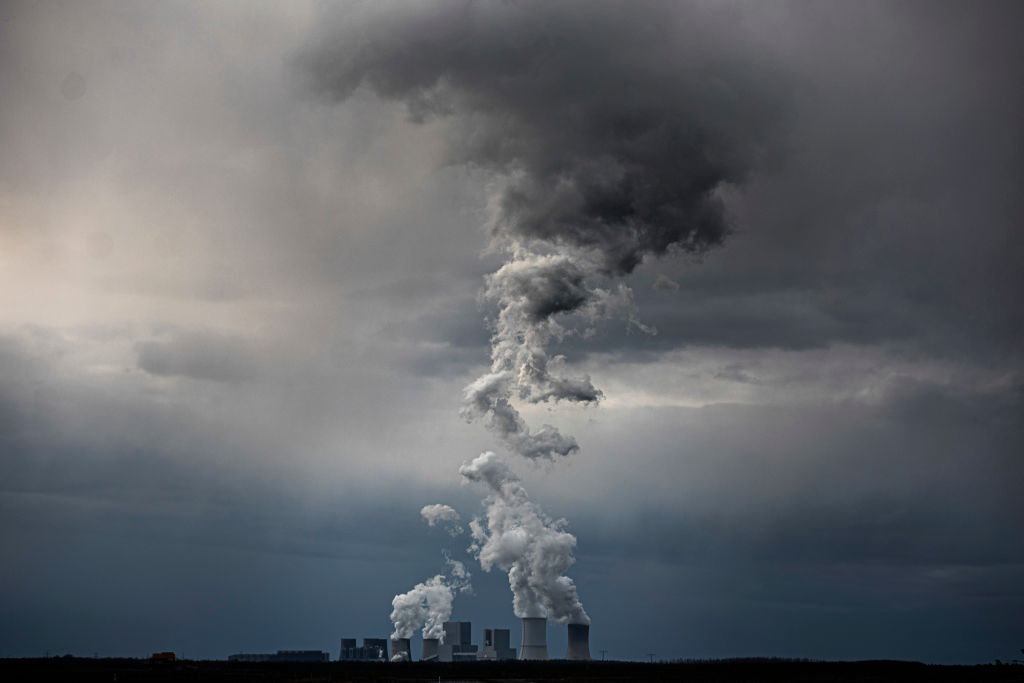 The coal power station of Boxberg in Saxony is pictured in front of dark clouds on March 30, 2020 in Neuliebel, Germany. (Florian Gaertner—Photothek via Getty Images)