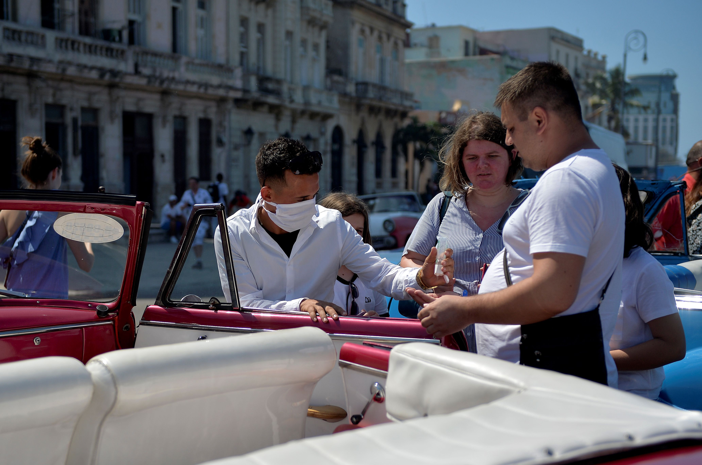 A private taxi driver getting ready to drive tourists around Havana, on March 19, 2020.  (Yamil Lage—AFP/Getty Images)
