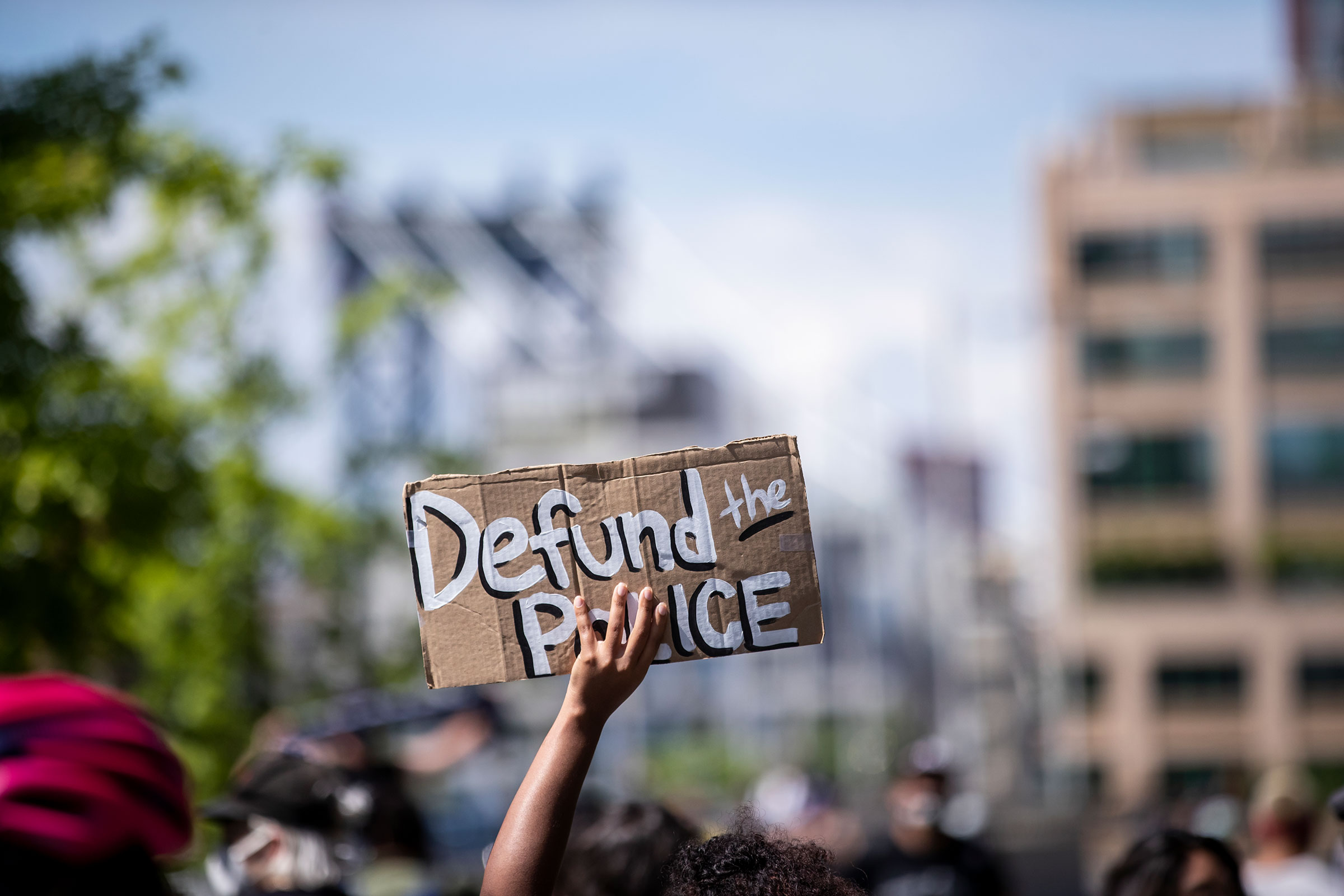 A protester holds up a homemade sign that says, "Defund the Police" during a peaceful protest in New York City June 19, 2020.