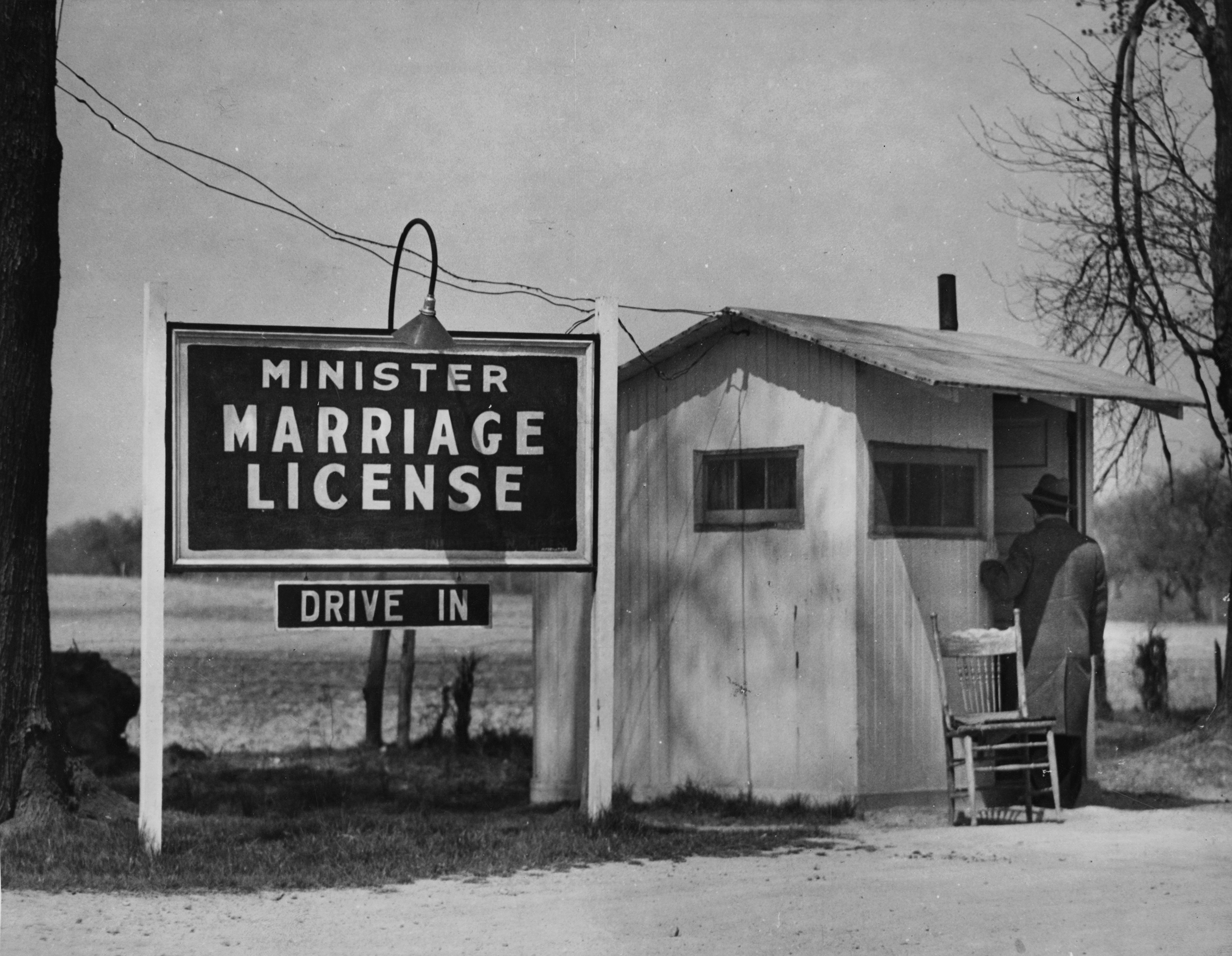 A walk-up customer at the door of a minister's marriage license booth in Elkton, Md. during the 1920-30s (Soibelman Syndicate/Visual Studies Workshop/Getty Image)