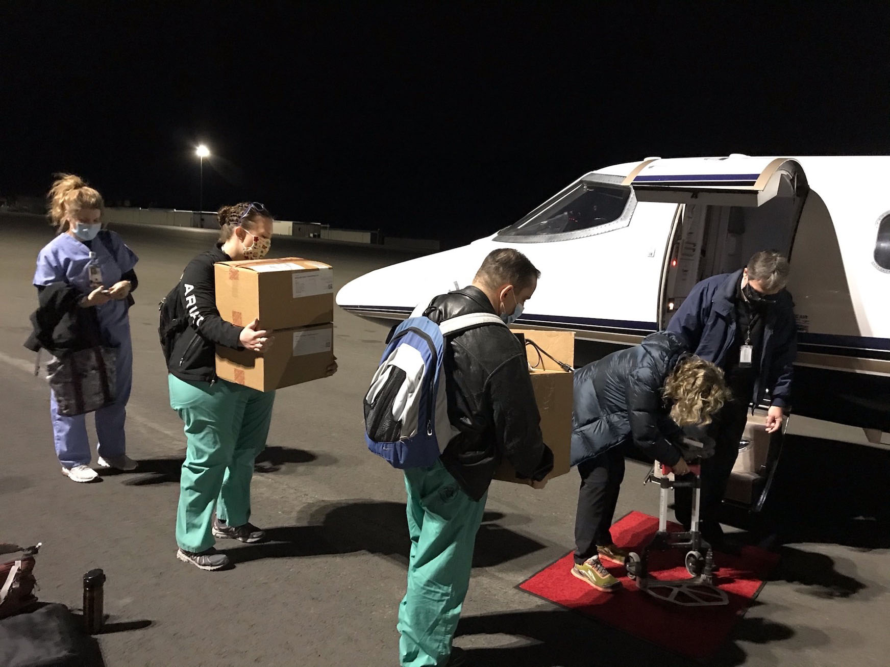 A vaccination team bound for Havre, Mont., loads supplies for transporting the Moderna vaccine into a plane at the Helena Regional Airport. Also on board were six Veterans Affairs providers tasked with inoculating rural veterans with the COVID-19 vaccine. (Courtesy of the Montana VA Health Care System)