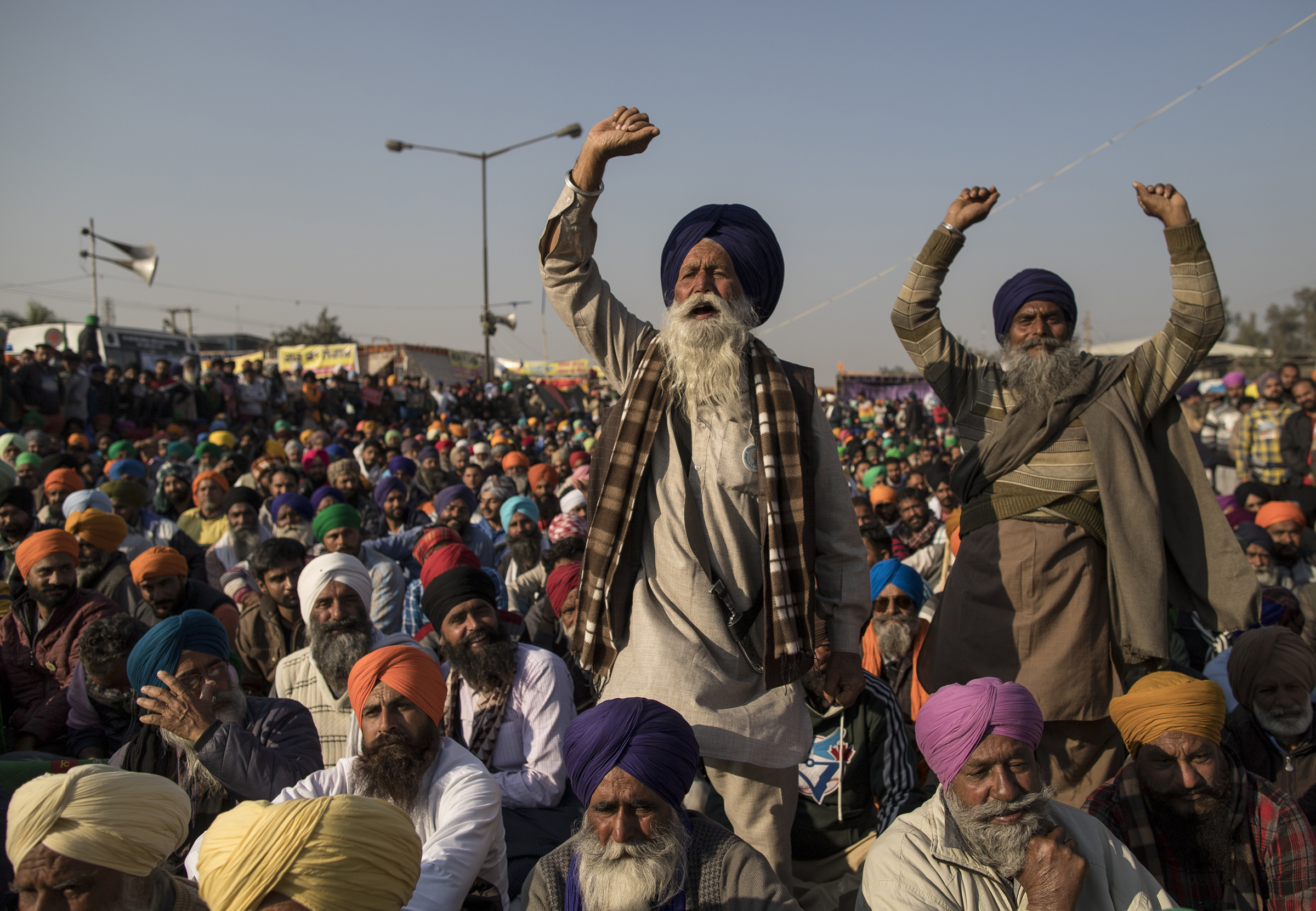 Farmers shout slogans as they participate in a protest at the Delhi Singhu border in Delhi, India on Dec. 18, 2020. (Anindito Mukherjee—Getty Images)