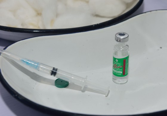A syringe and a Covishield vaccine vial are seen on a plate during the Covid19 vaccination in Kolkata on Jan. 19