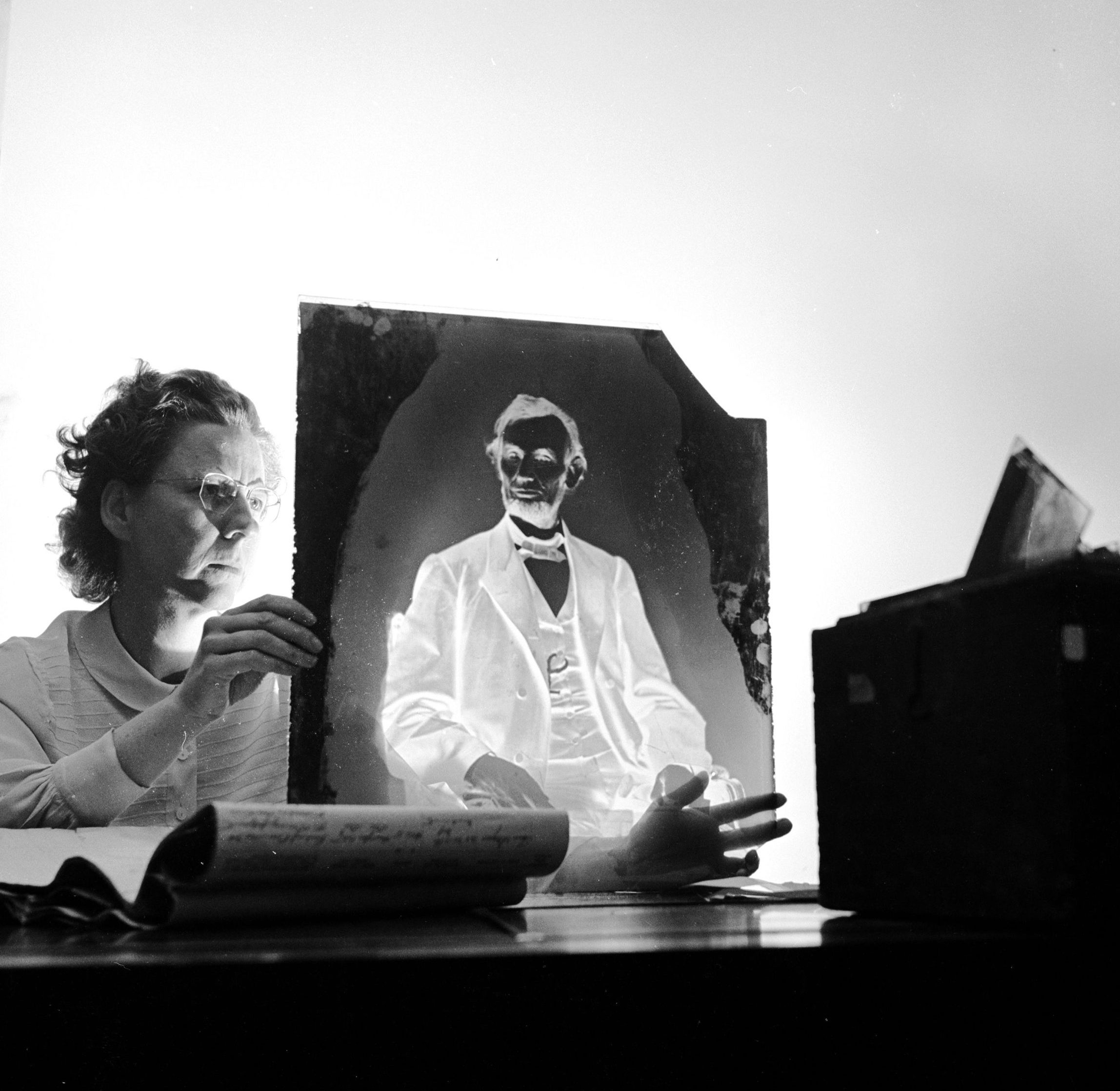 A researcher holding one of America's most priceless negatives, the glass plate made by famous civil war photographer Mathew Brady of Abraham Lincoln in 1865 just before the 16th President of the United States was assassinated. It is stored in the National Archives in Washington. (Three Lions/Getty Images)