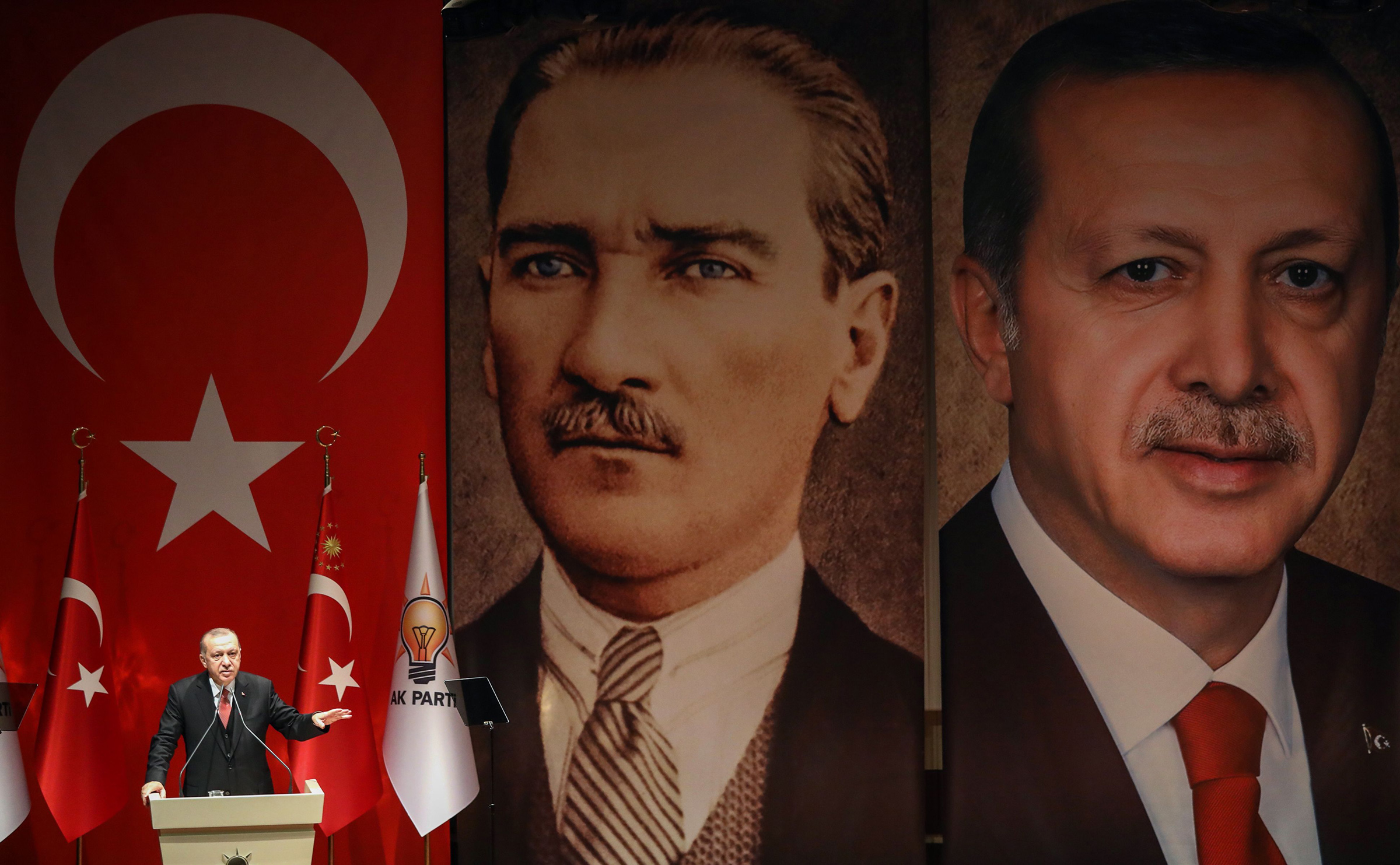 Turkish President Recep Tayyip Erdogan addresses a meeting of election officials in front of portraits of himself and Mustafa Kemal Ataturk, the founder of modern Turkey, in Ankara on Jan. 29, 2019. (Adem Altan— AFP/Getty Images)