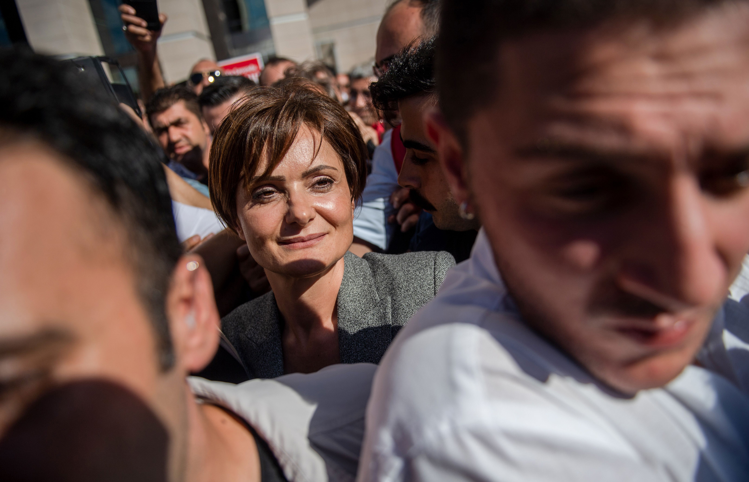 Dr. Canan Kaftancioglu, center, leaves the Caglayan courthouse in Istanbul on Sept. 6, 2019. (Bulent Kilic—AFP/Getty Images)
