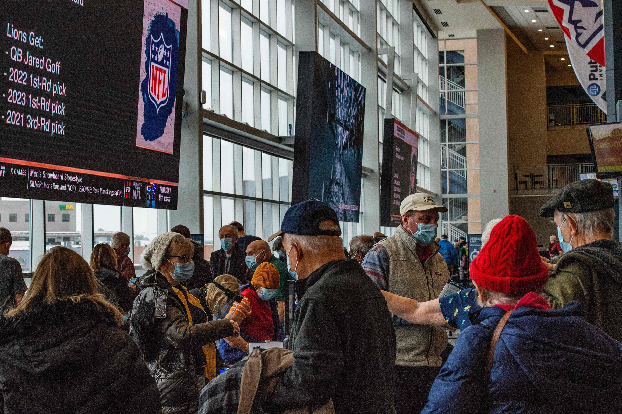 Hundreds of people move through Gillette Stadium in Foxborough, Mass., as they receive their COVID-19 vaccine on Feb. 1, 2021. (Joseph Prezioso—AFP/Getty Images)