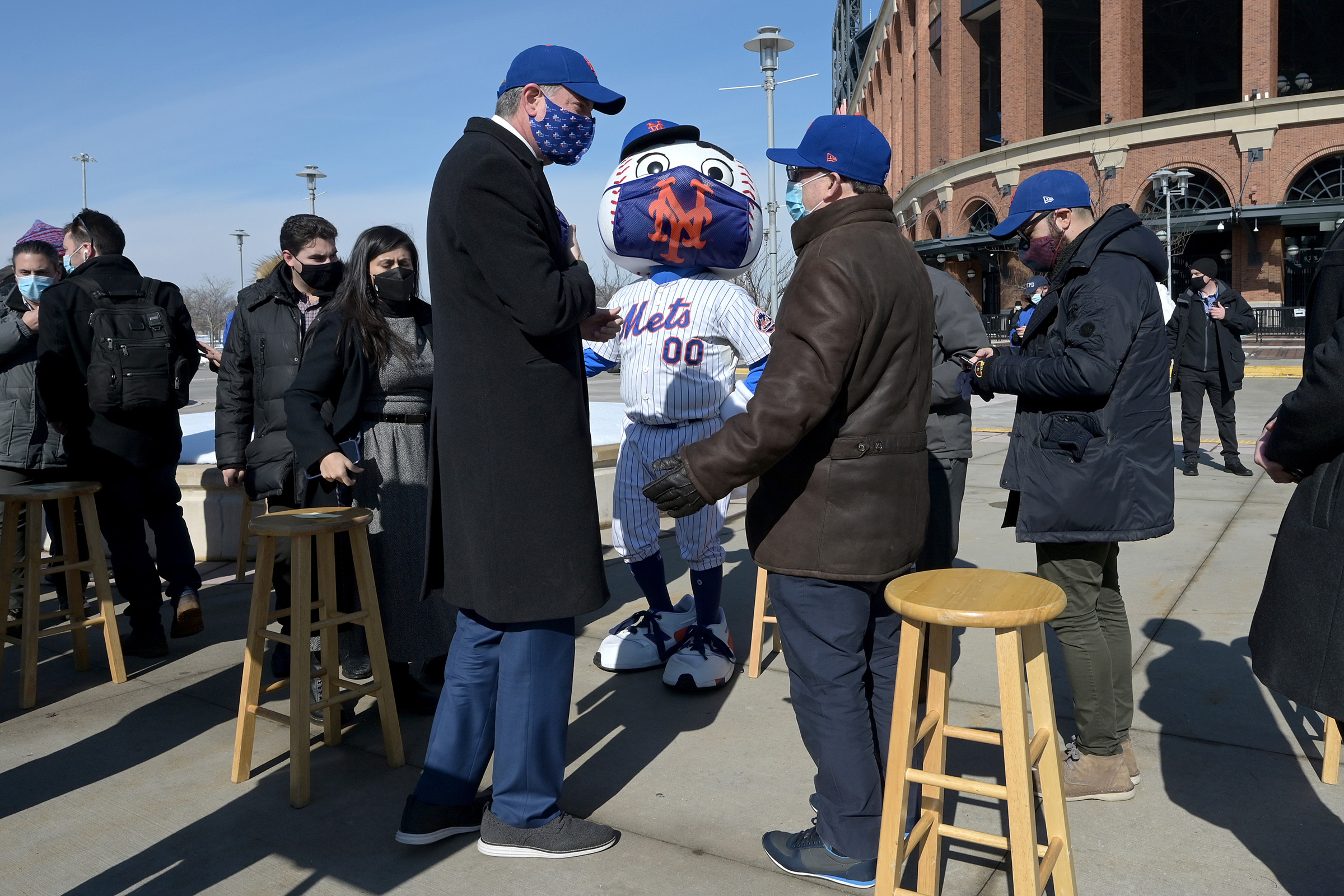 New York City Mayor Bill de Blasio, left, and New York Mets baseball team owner Steve Cohen speak after a press conference to announce the opening of Mets Citi Field stadium as a COVID-19 Vaccine Mega Hub in Queens, N.Y., on Feb. 10, 2021. (Anthony Behar—Sipa/AP)