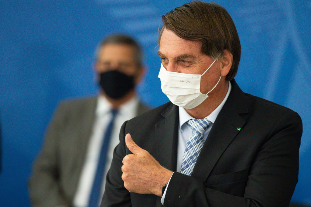 Jair Bolsonaro, Brazils president, gestures during a bill signing ceremony at the Planalto Palace in Brasilia, Brazil, on Wednesday, March 10, 2021. (Andressa Anholete –Bloomberg/Getty Images)