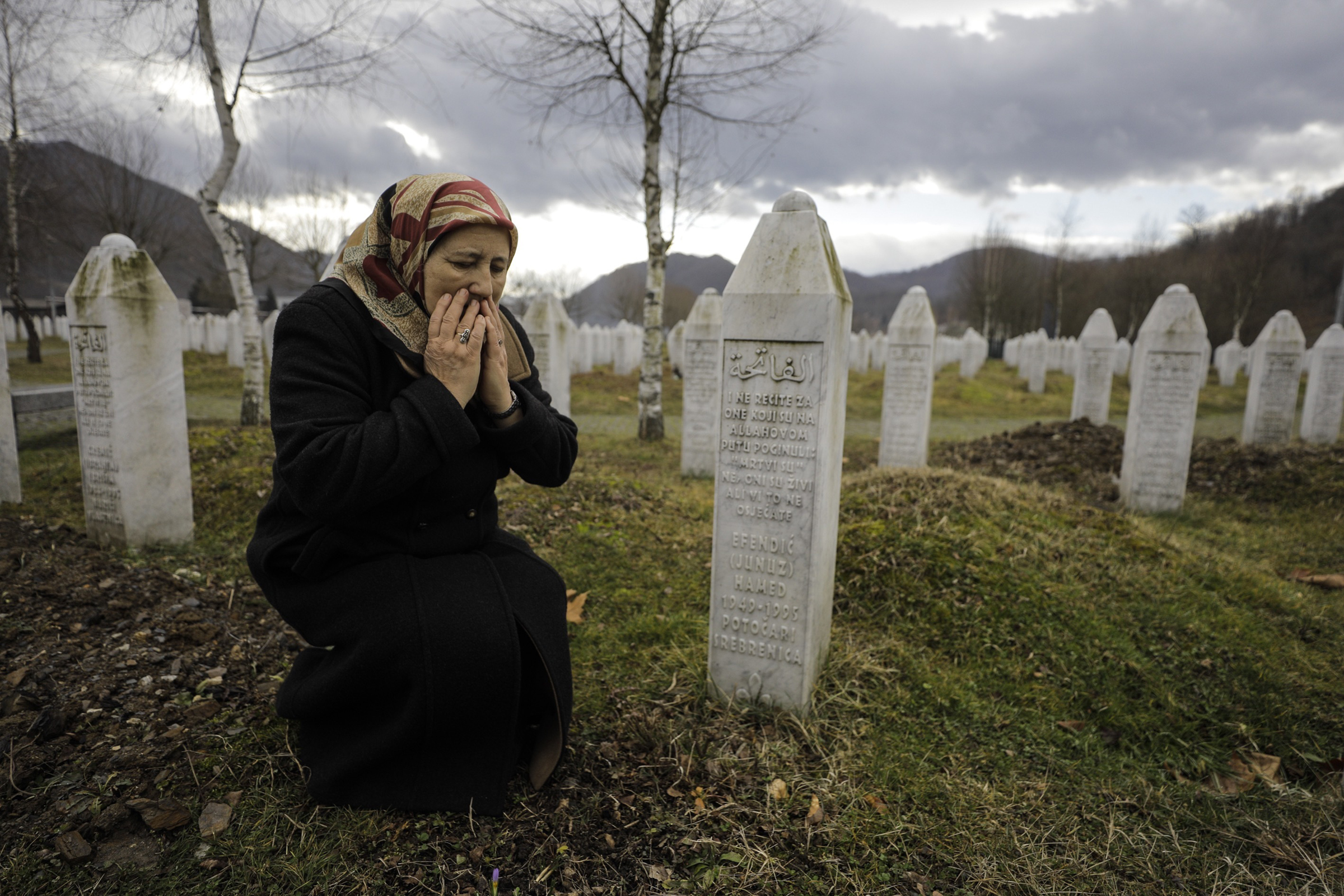 Mother of a Srebrenica victim Fazila Efendic, the mother of a Srebrenica victim visits the graves of her husband and son in Srebrenica, Bosnia, on Feb. 15, 2020. They lost their lives in the Srebrenica genocide, which started on July 11, 1995. (Samir Jordamovic—Anadolu Agency/Getty Images)