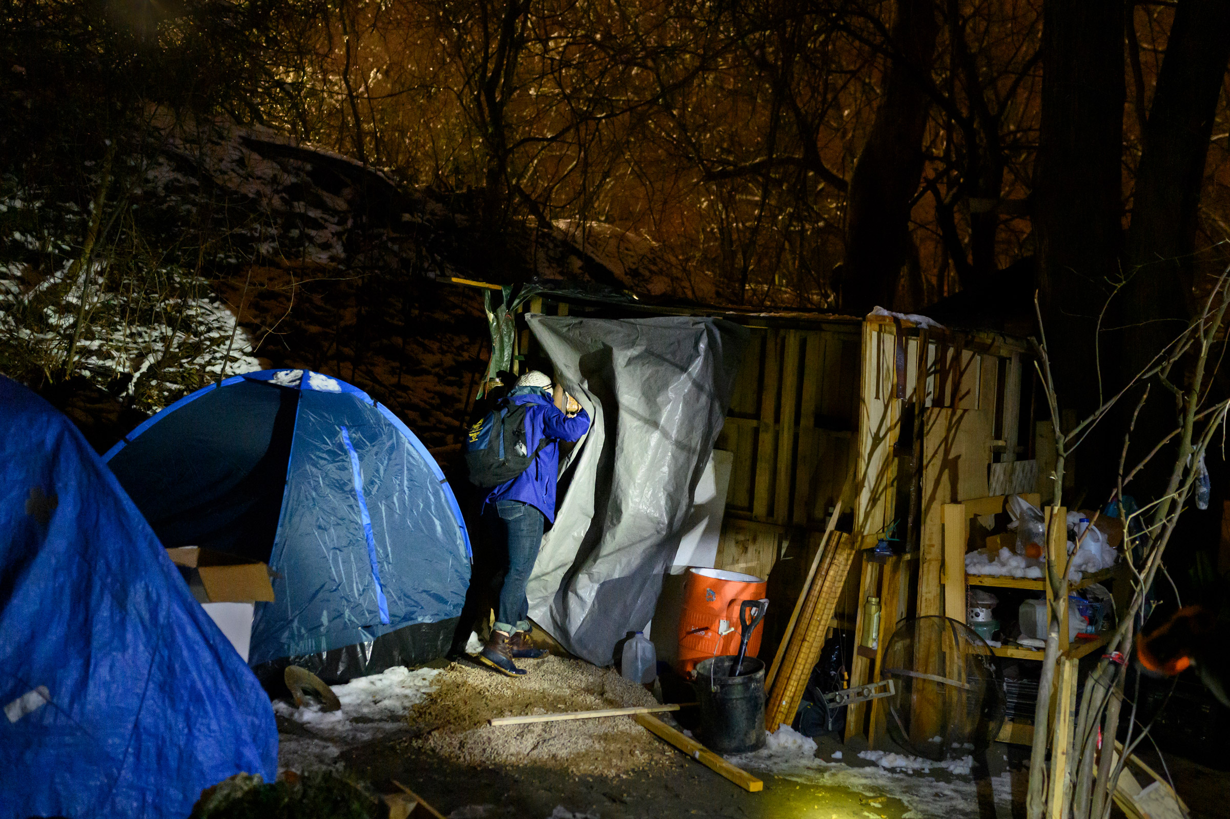 Nurse Crystal Bauer checks on a resident at a homeless encampment on Dec 18. Bauer helped start Project Hope, a street-medicine program supported through community donations. (Rebecca Kiger)