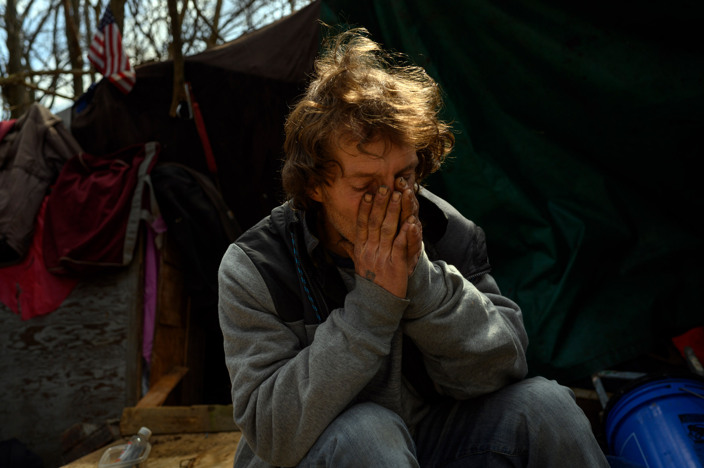 Ron at his hillside encampment on March 16, the day the winter shelter closed for the next nine months. (Rebecca Kiger for TIME)