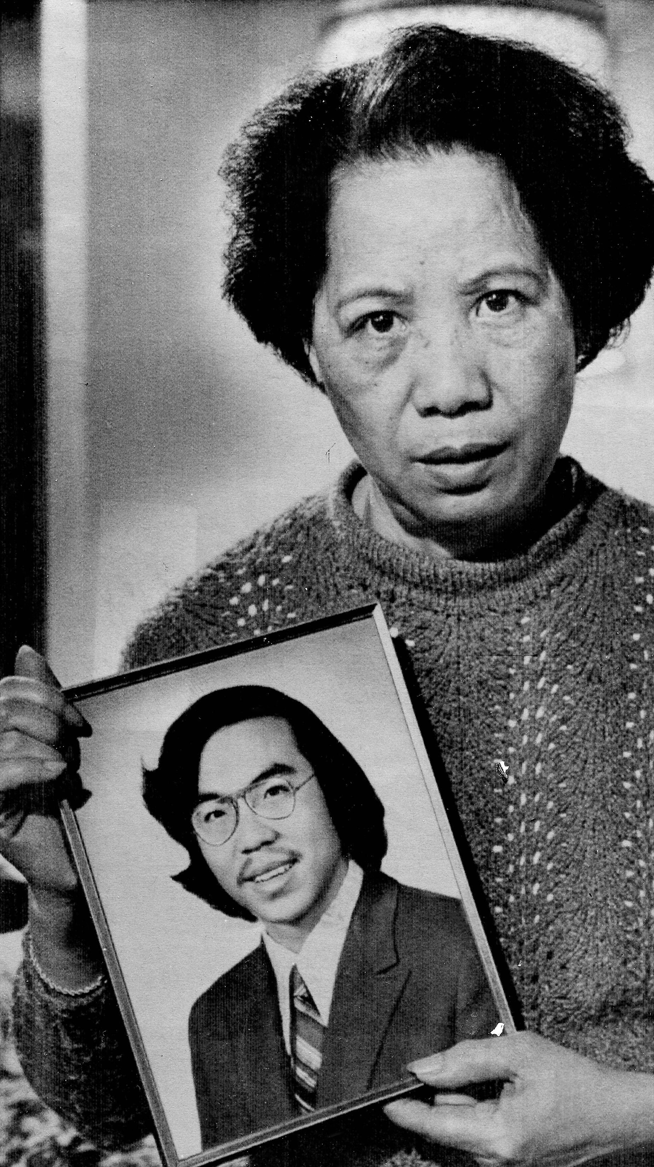 Lily Chin holds a photograph of her son Vincent, 27, who was beaten to death on June 23, 1982, in a photo made Nov. 2, 1983. A federal grand jury returned a criminal indictment on federal civil rights charges against two white East Detroit men who were place on probation after admitting they beat the Chinese-American man to death with a baseball bat. Ronald Ebens, 44, and his stepson, Michael Nitz, 25, were charged in a two-count indictment.