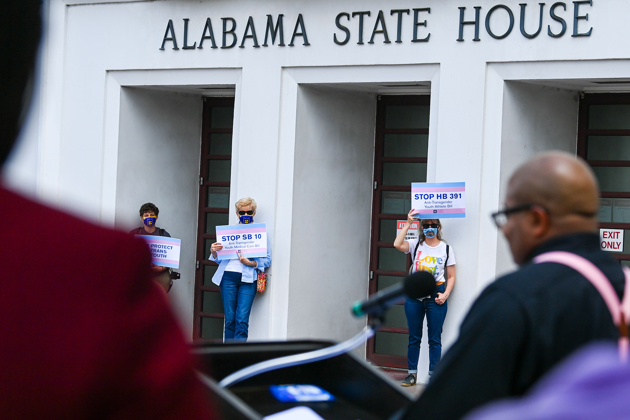 Opponents of several bills targeting transgender youth attend a rally at the Alabama State House to draw attention to anti-transgender legislation introduced in Alabama on March 30, 2021. (Julie Bennett—Getty Images)