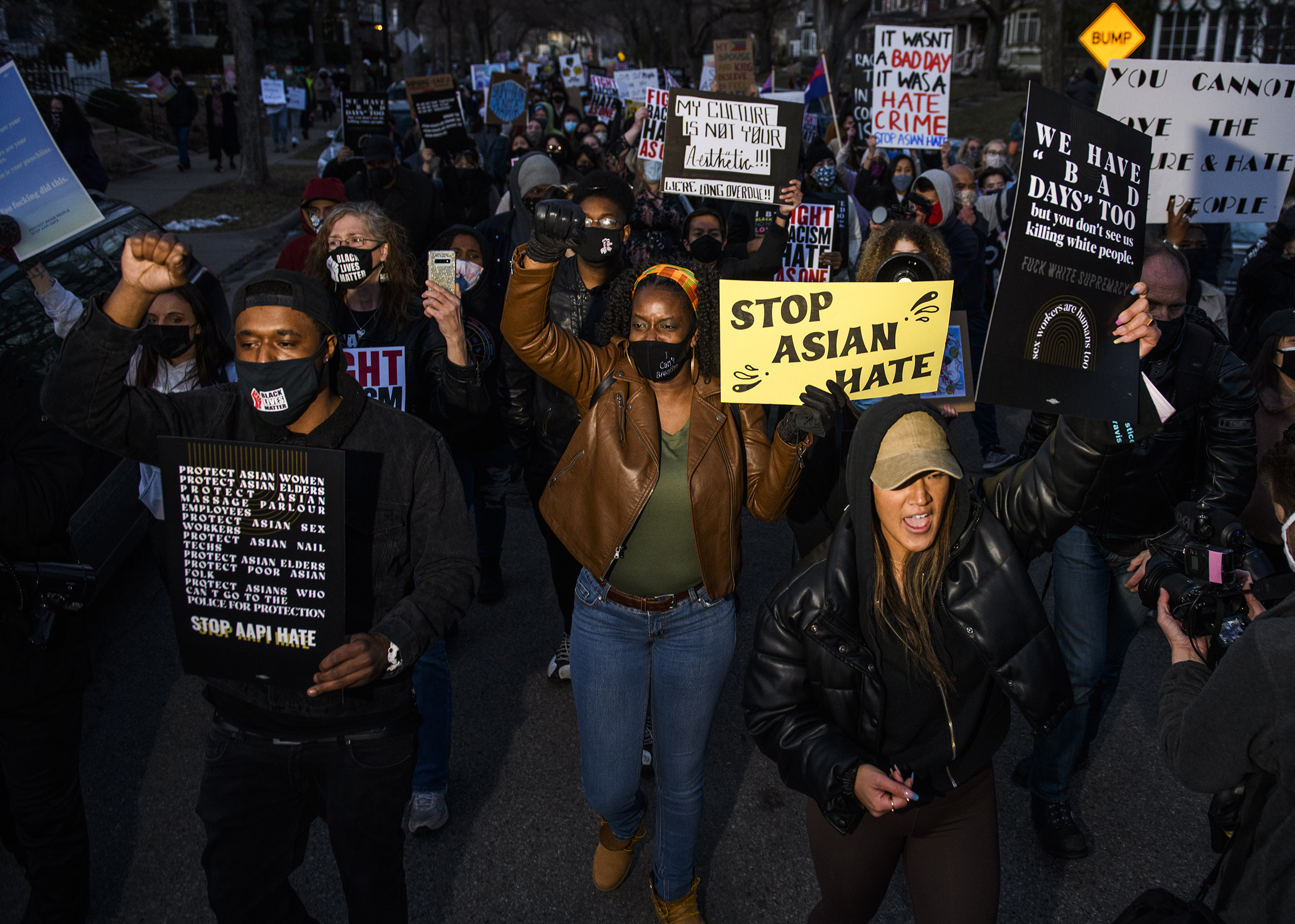 People march through a neighborhood to protest against anti-Asian violence on March 18 in Minneapolis