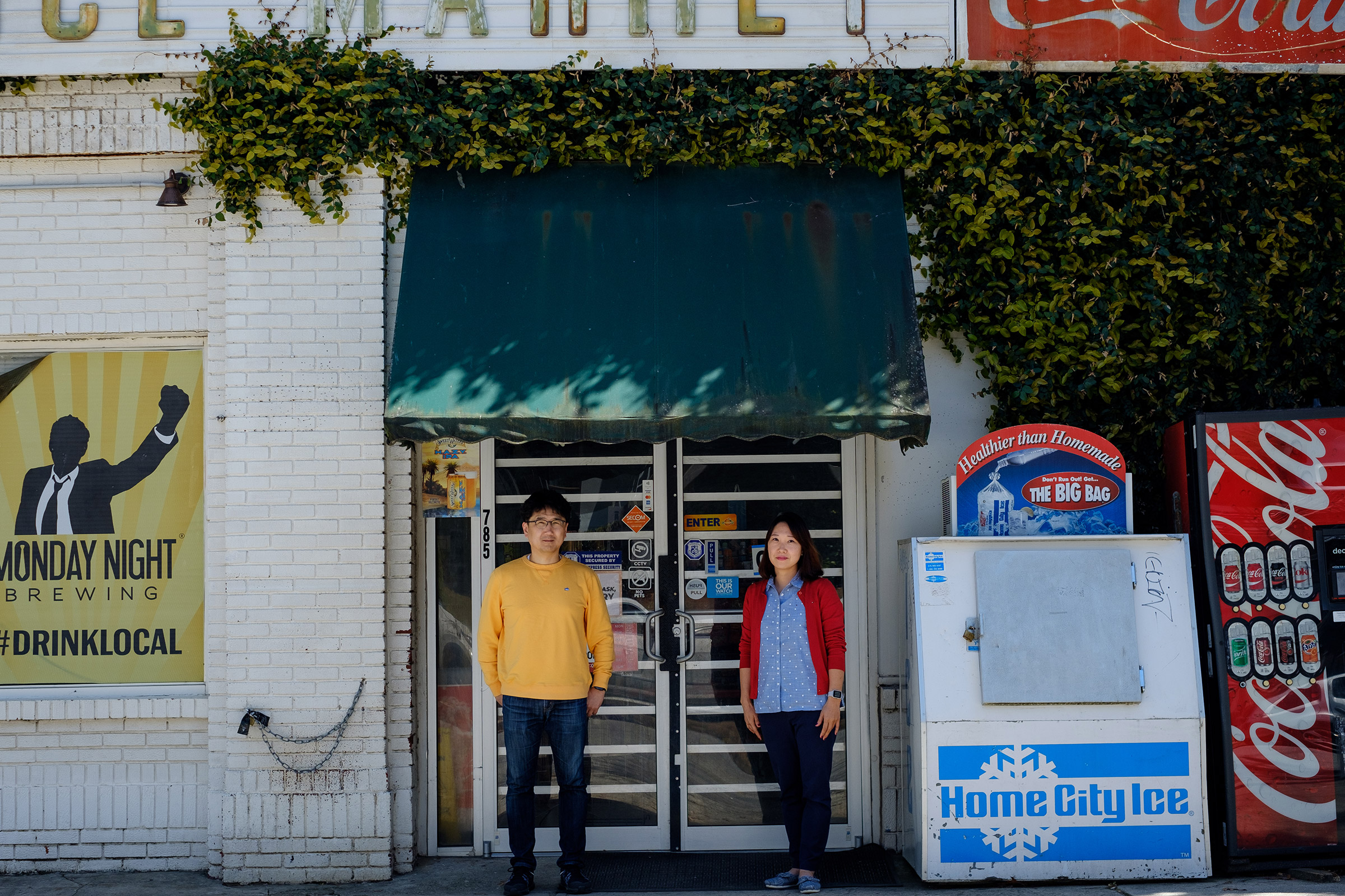 Jun Kim and Sunghee Kim pose for a portrait at L&amp;M Market in Atlanta, Georgia on March 22, 2021. Photo by Arvin Temkar.
