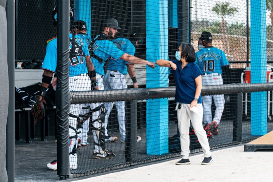 Ng greets Miami Marlins prospect Cameron Barstad on Feb.â€¯18, the opening day of spring training, in Jupiter, Fla. 