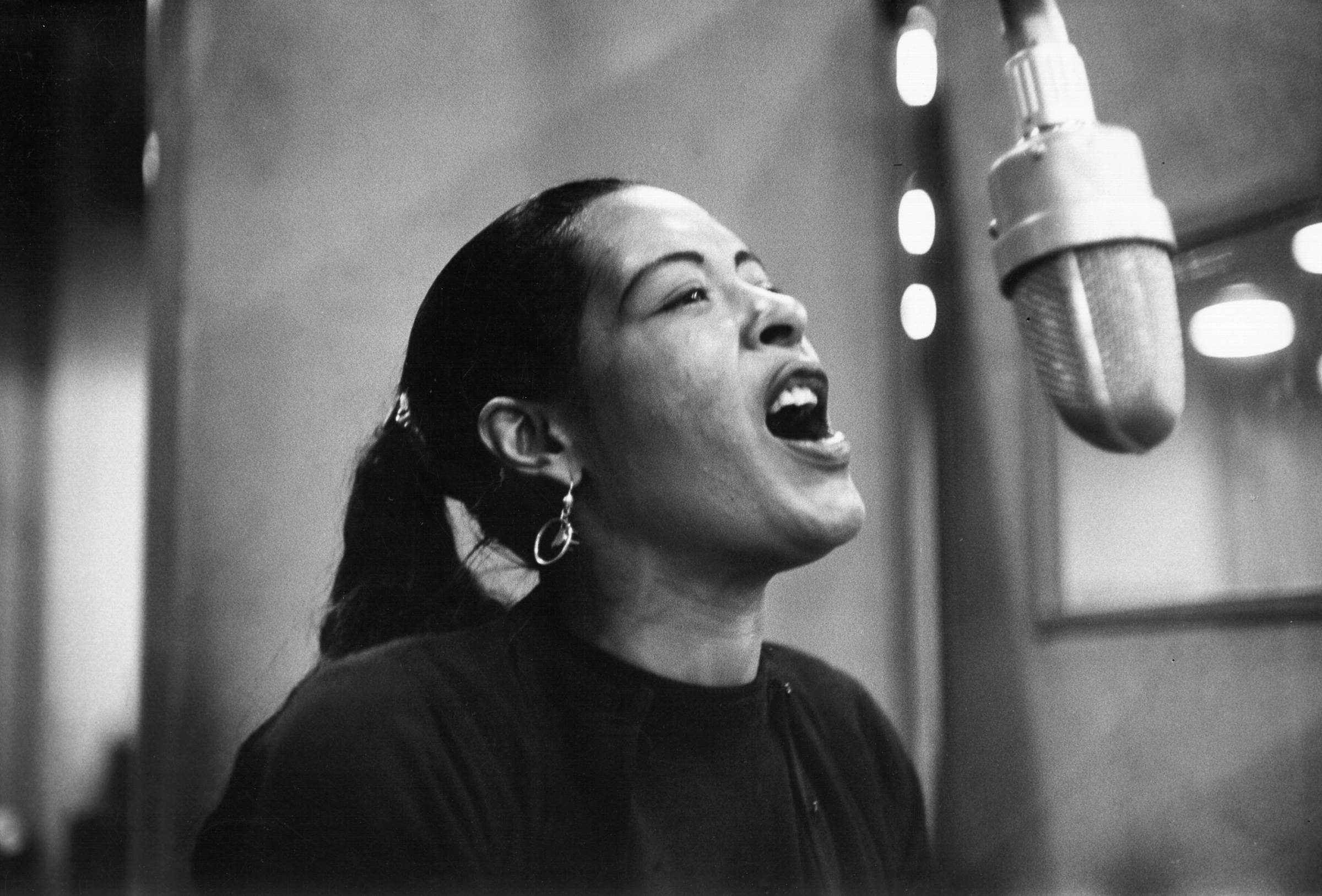 Singer Billie Holiday records her penultimate album at the Columbia Records studio in New York in Dec. 1957. (Michael Ochs Archives—Getty Images)