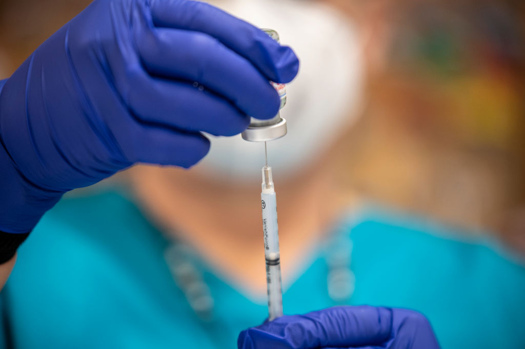 A nurse fills up a syringe with the Moderna COVID-19 vaccine at a vaccination site at a senior center on March 29, 2021 in San Antonio, Texas. (Sergio Flores—Getty Images)