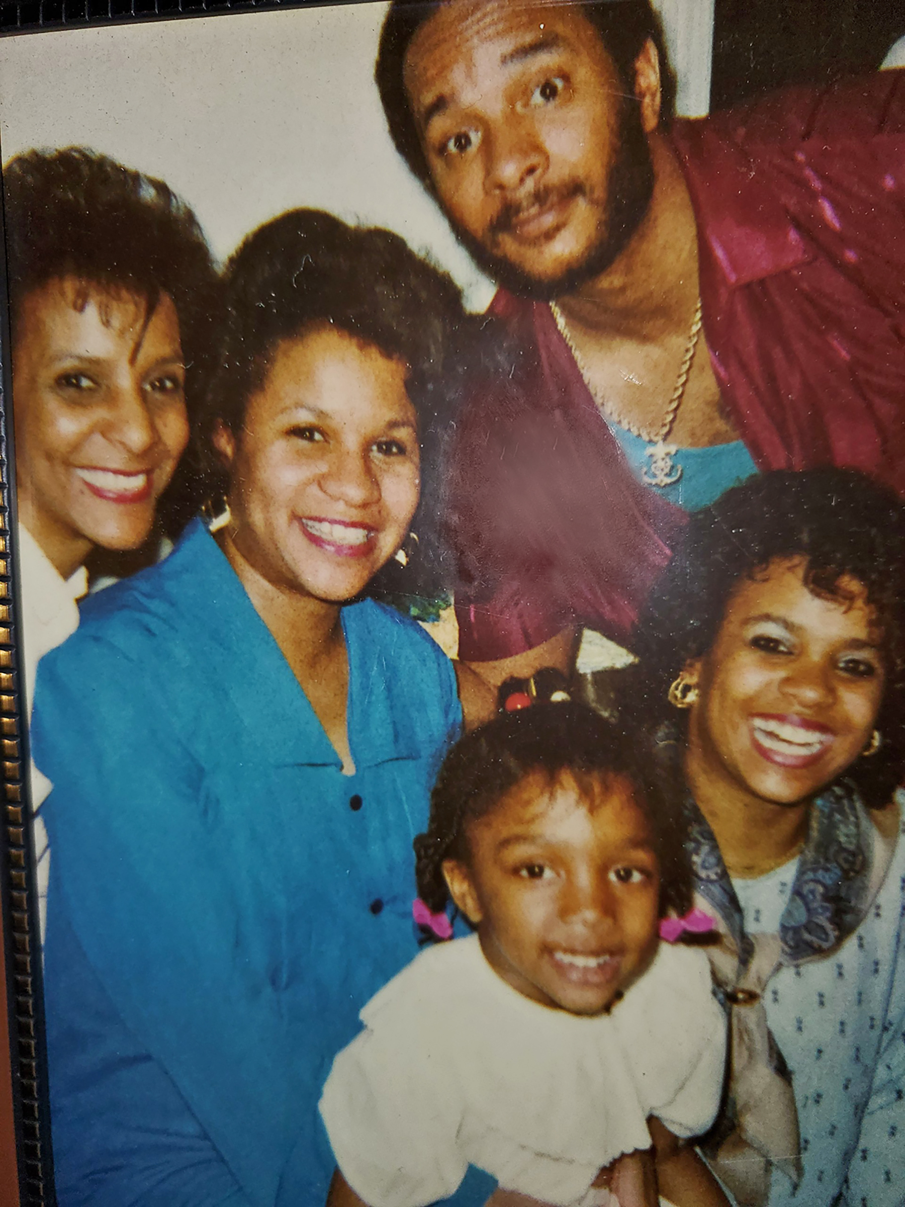 Christopher Burns in a 1990s family photo with his mother, two sisters and daughter Keli, front (Courtesy Keli Burns)