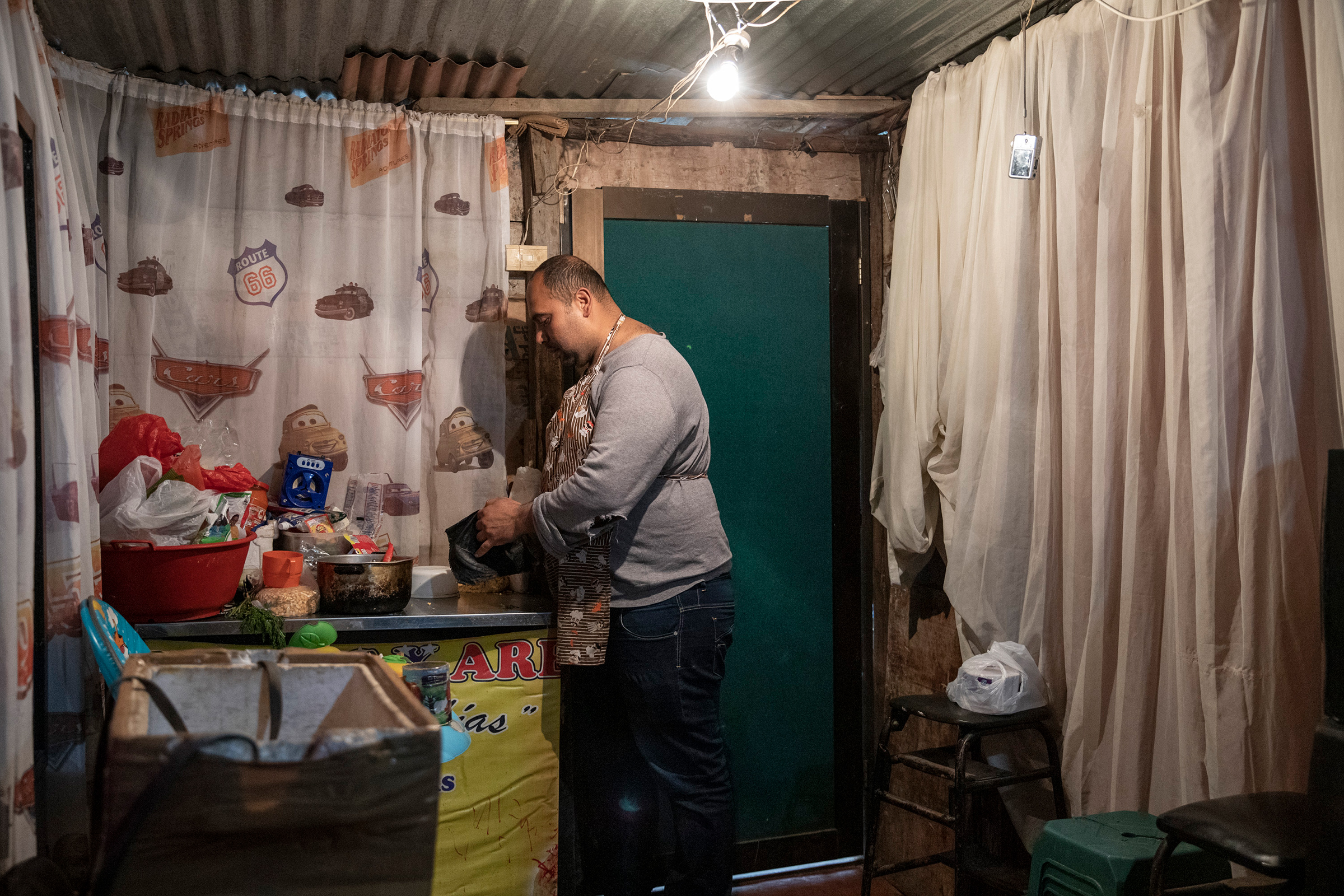Nixon Valera, who arrived in 2018, wakes at 5:30 a.m. every day to make empanadas to sell on the streets of Bogotá; in Venezuela, he worked in the plastics industry.
