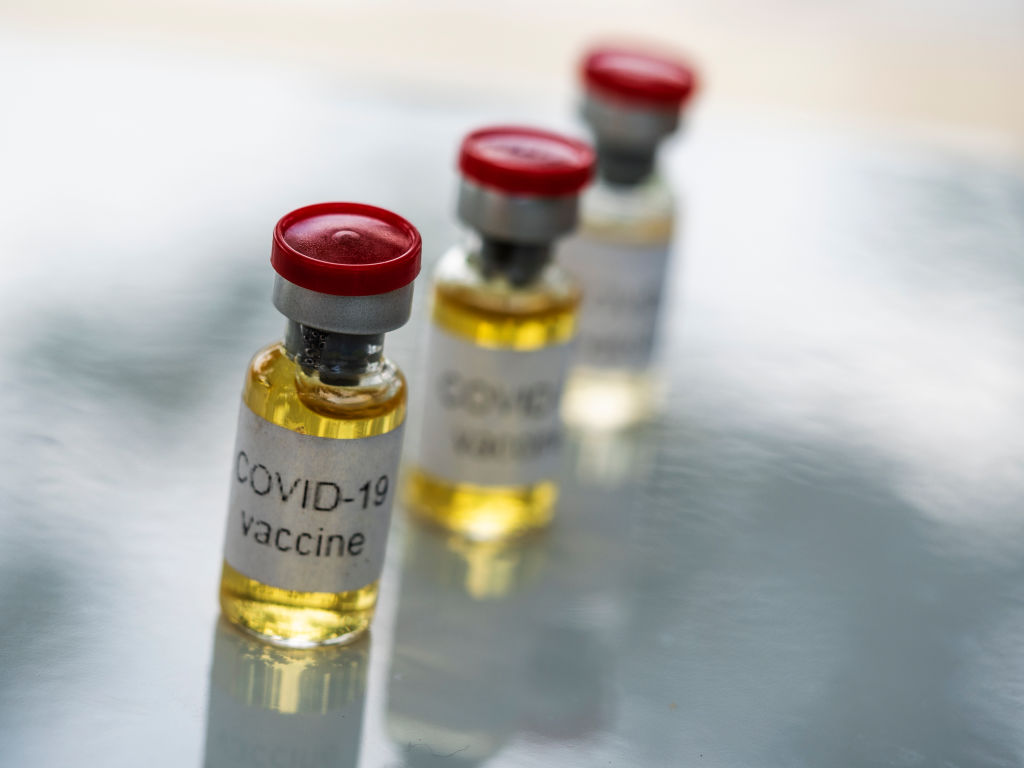 In this photo illustration, fake vials labelled 'Covid-19