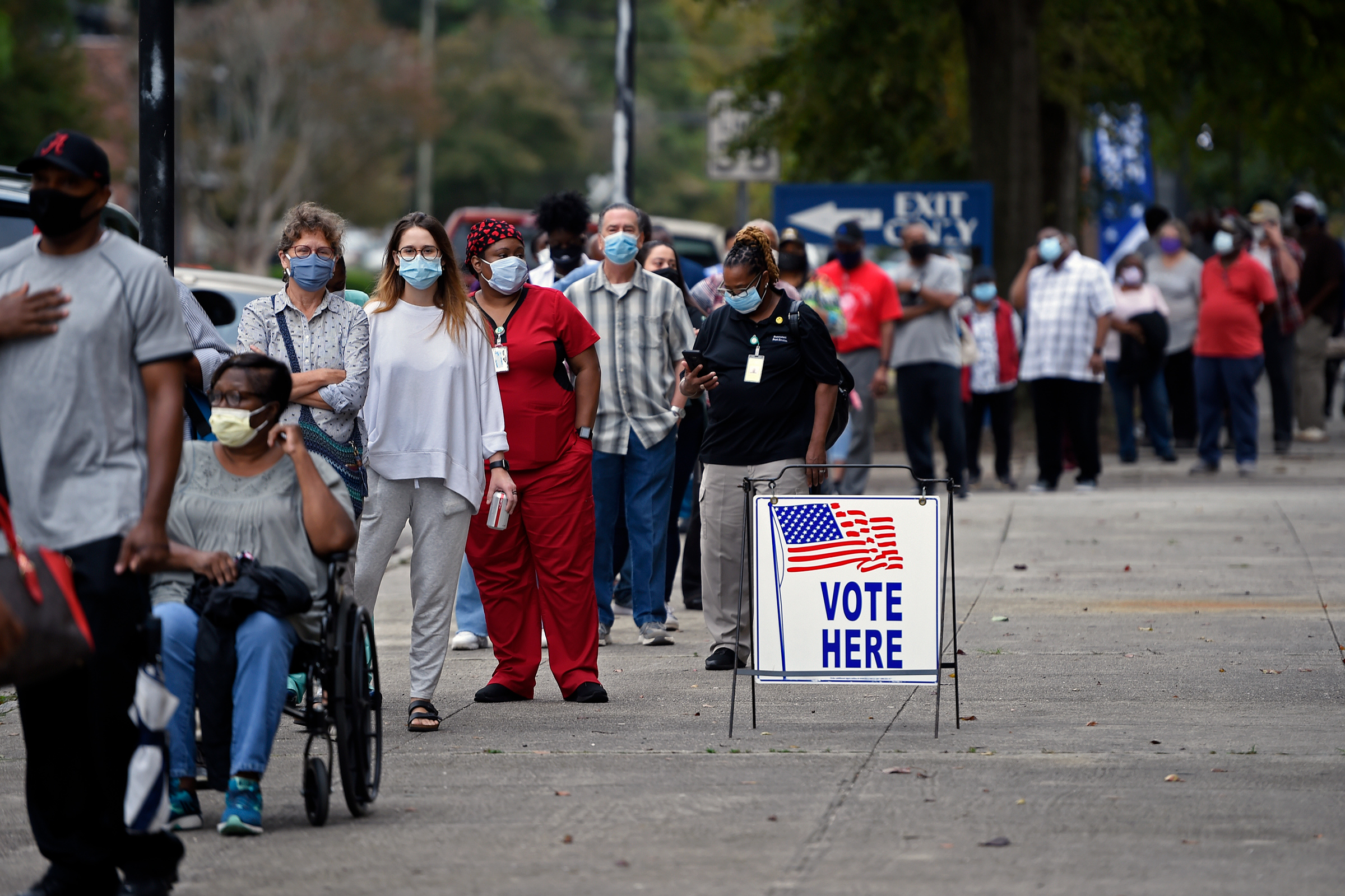 People wait in line for early voting at the Bell Auditorium in Augusta, Ga on Oct. 12, 2020. (Michael Holahan—The Augusta Chronicle/AP)
