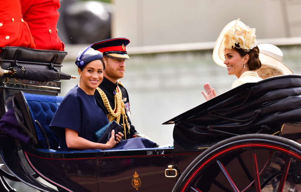 Meghan, Duchess of Sussex, Prince Harry, Duke of Sussex and Catherine, Duchess of Cambridge leave Buckingham Palace in a carriage during Trooping The Colour, the Queen's annual birthday parade, on June 8, 2019 in London, England. (Getty Images—2019 James Devaney)