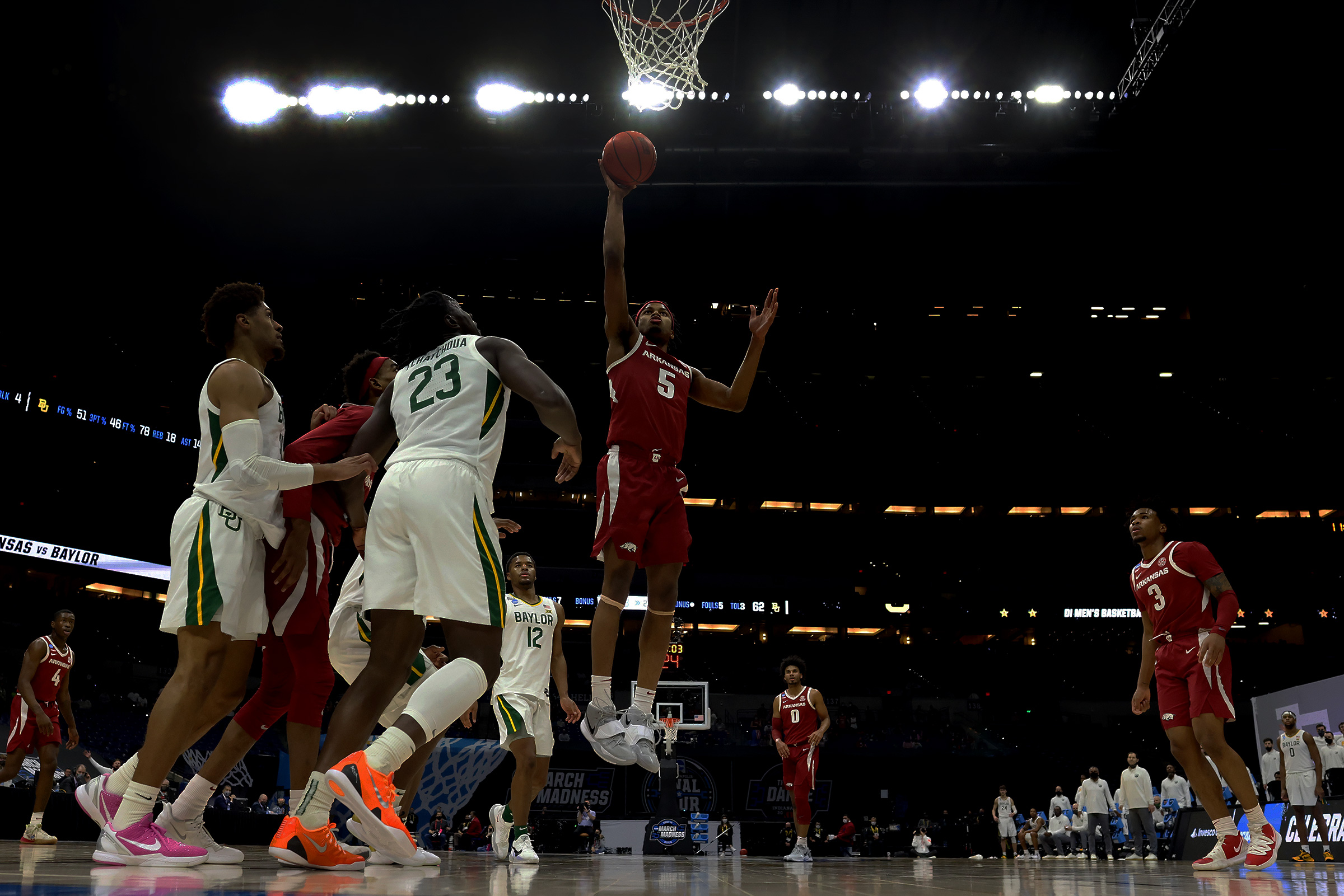 Moses Moody #5 of the Arkansas Razorbacks scores against the Baylor Bears in the Elite Eight round of the 2021 NCAA Division I Men's Basketball Tournament held at Lucas Oil Stadium on March 29, 2021 in Indianapolis, Indiana. (Jamie Schwaberow—NCAA Photos/Getty Images)