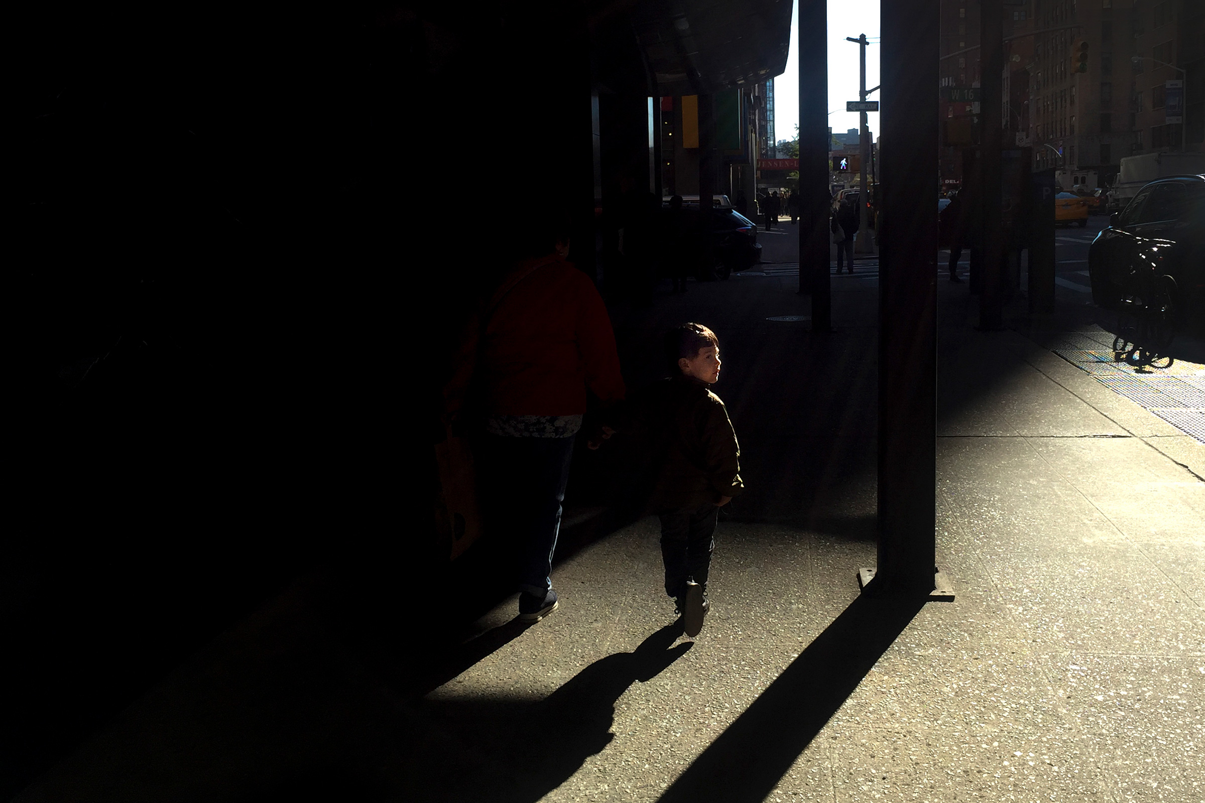 A young boy in New York walks by.