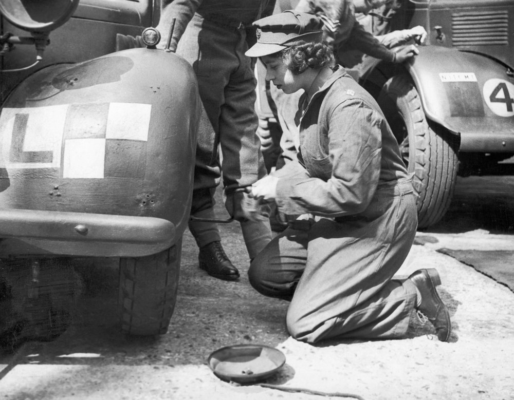 Princess Elizabeth learning basic car maintenance as a Second Subaltern in the A.T.S on April 12, 1945.