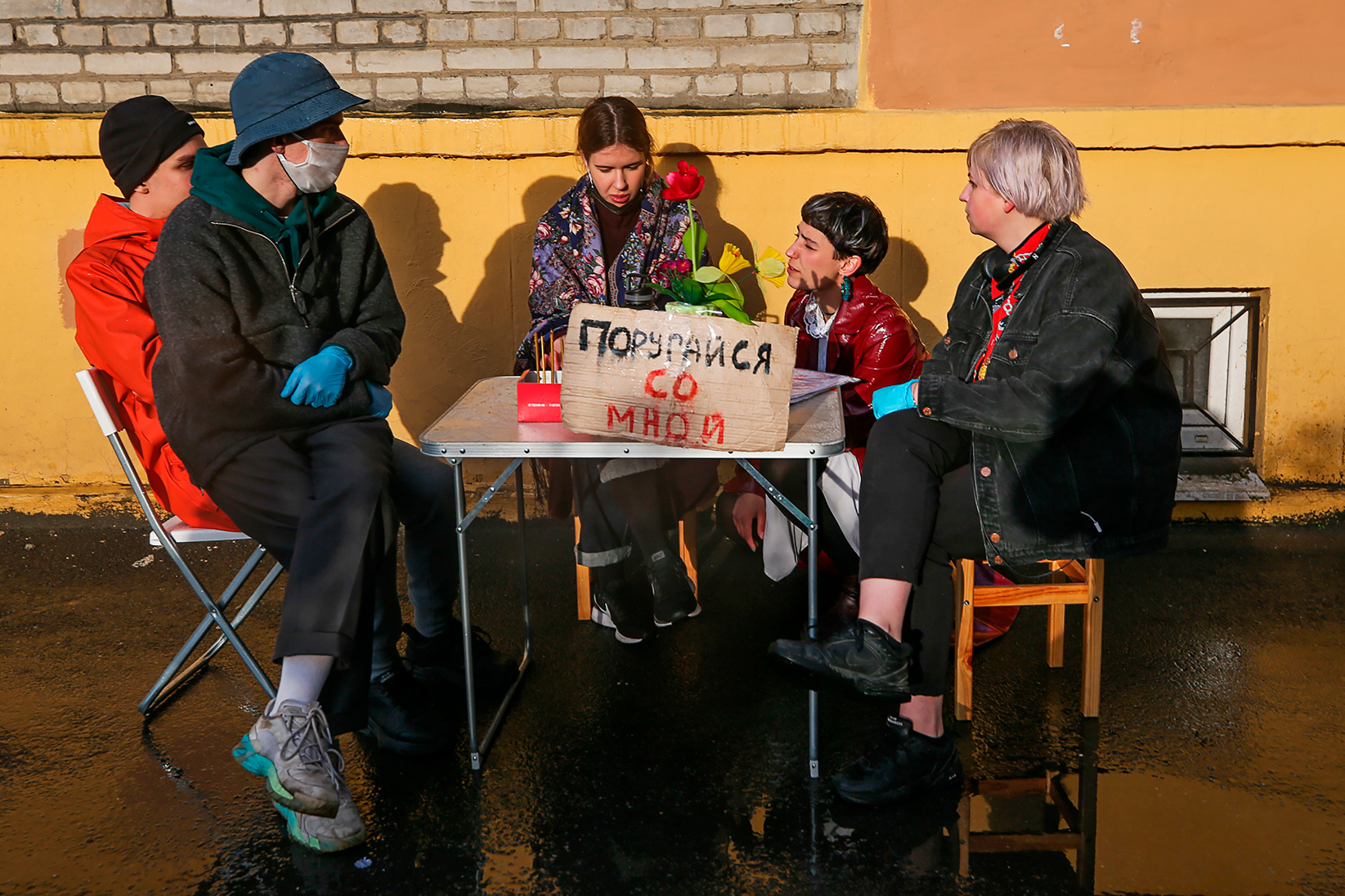 The art performance Quarrel With Me, shown in St. Petersburg in May, was organized by artist and activist Katrin Nenasheva, second from right, to address the topic of domestic violence during Russia’s lockdown. In the performance, Nenasheva invites people to have a quarrel with her. (Peter Kovalev—TASS/Getty Images)