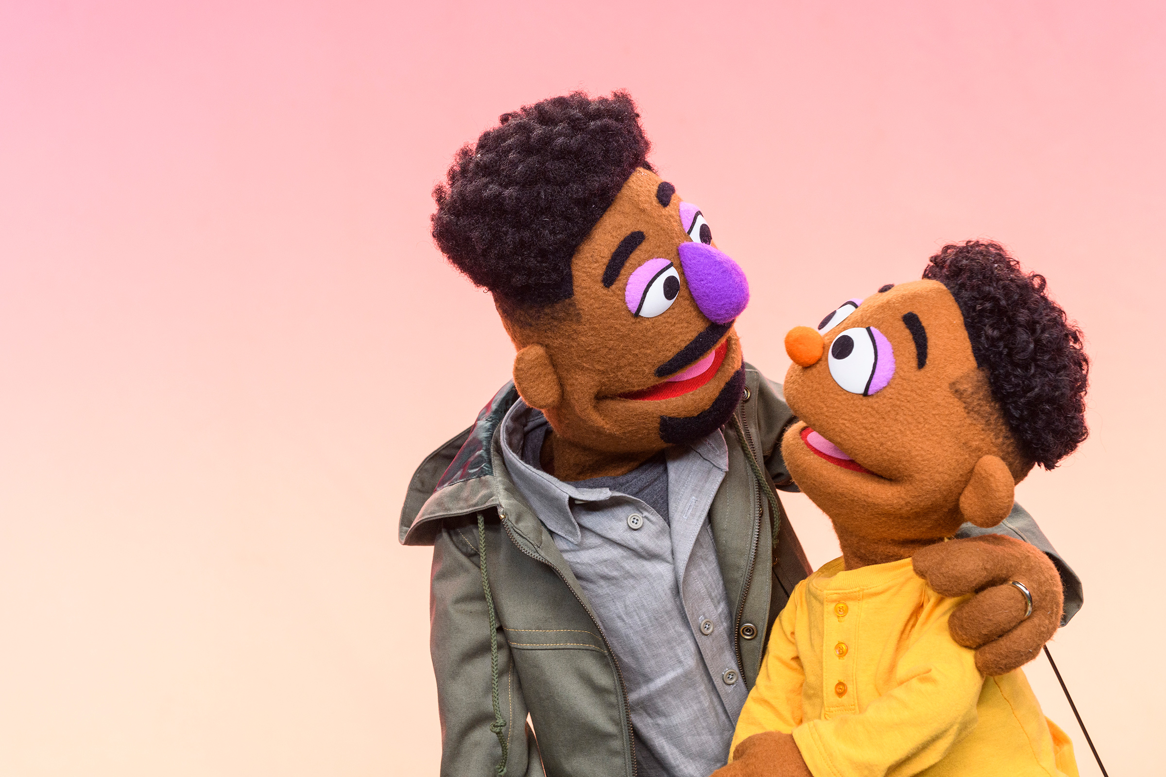 Elijah Walker, 35, a new Black Muppet who, along with his son Wesley, 5, will be introduced on March 23 by Sesame Workshop, the nonprofit behind Sesame  Street (Zach Hyman—Sesame Workshop)