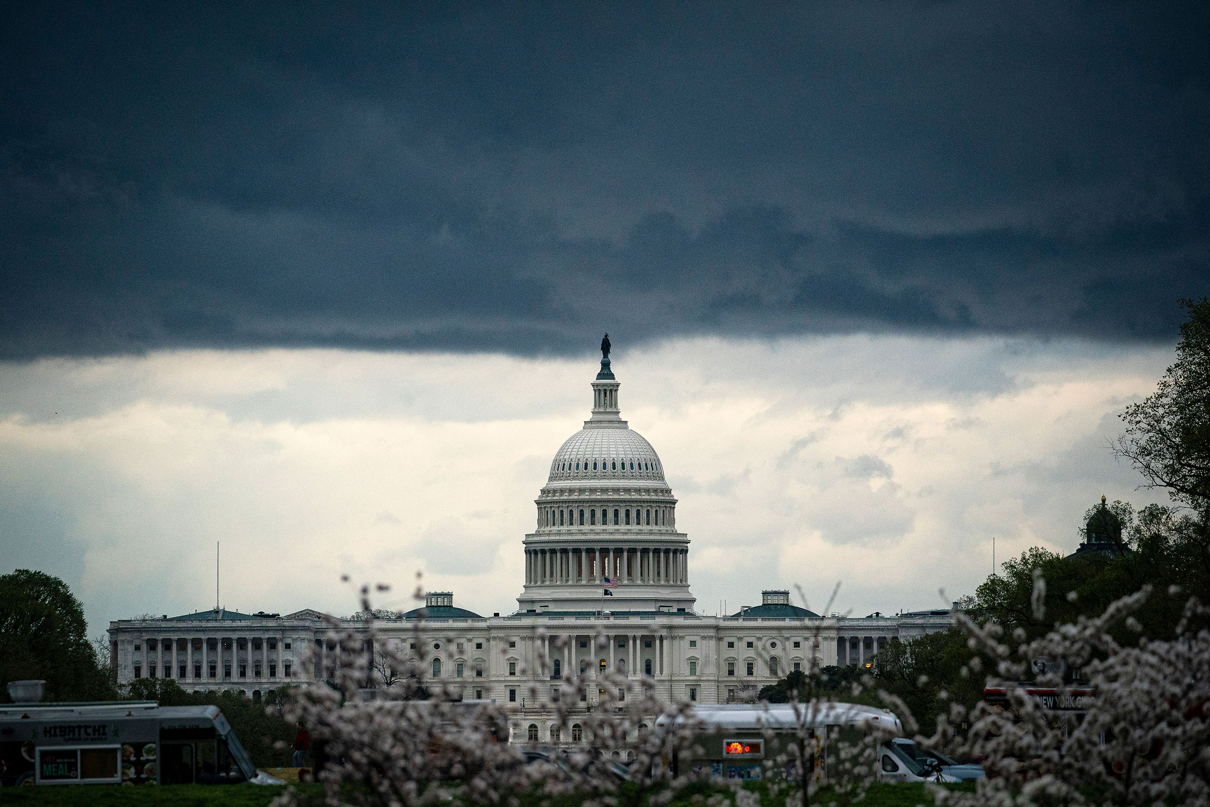 Clouds form above the U.S. Capitol in between rain showers on the National Mall on March 28, 2021. (Al Drago—Getty Images)