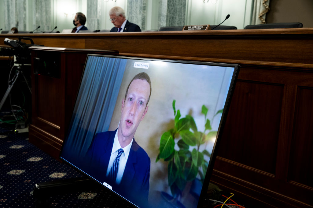 CEO of Facebook Mark Zuckerberg appears on a monitor as he testifies remotely during the Senate Commerce, Science, and Transportation Committee hearing 'Does Section 230's Sweeping Immunity Enable Big Tech Bad Behavior?', on Capitol Hill, October 28, 2020 in Washington, DC. (Getty Images—2020 Getty Images)